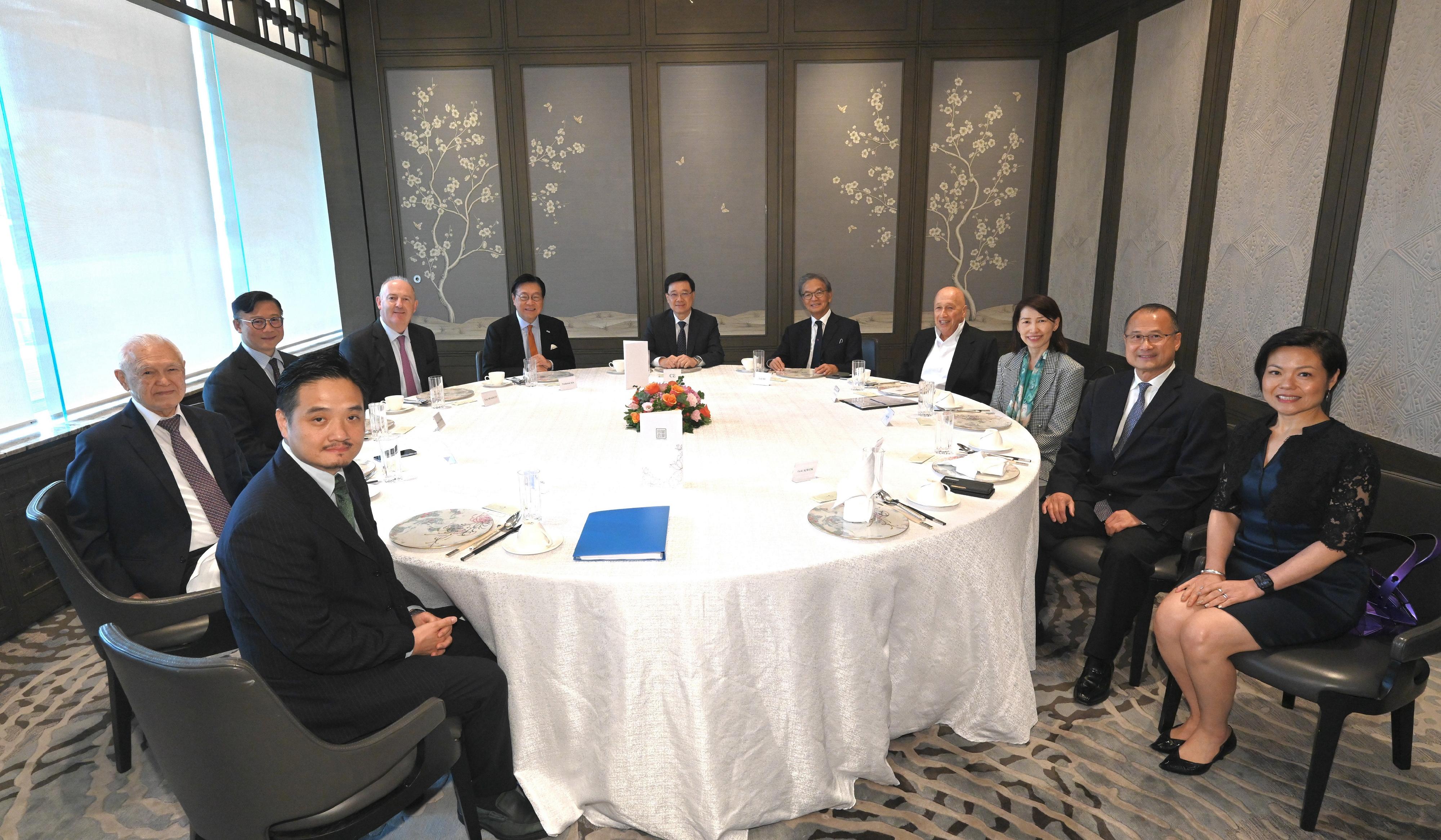 The Chief Executive, Mr John Lee, hosted luncheon meetings of the Chief Executive's Council of Advisers (CECA) to listen to views expressed by CECA members for the forthcoming Policy Address. Photo shows the third session held on July 11.