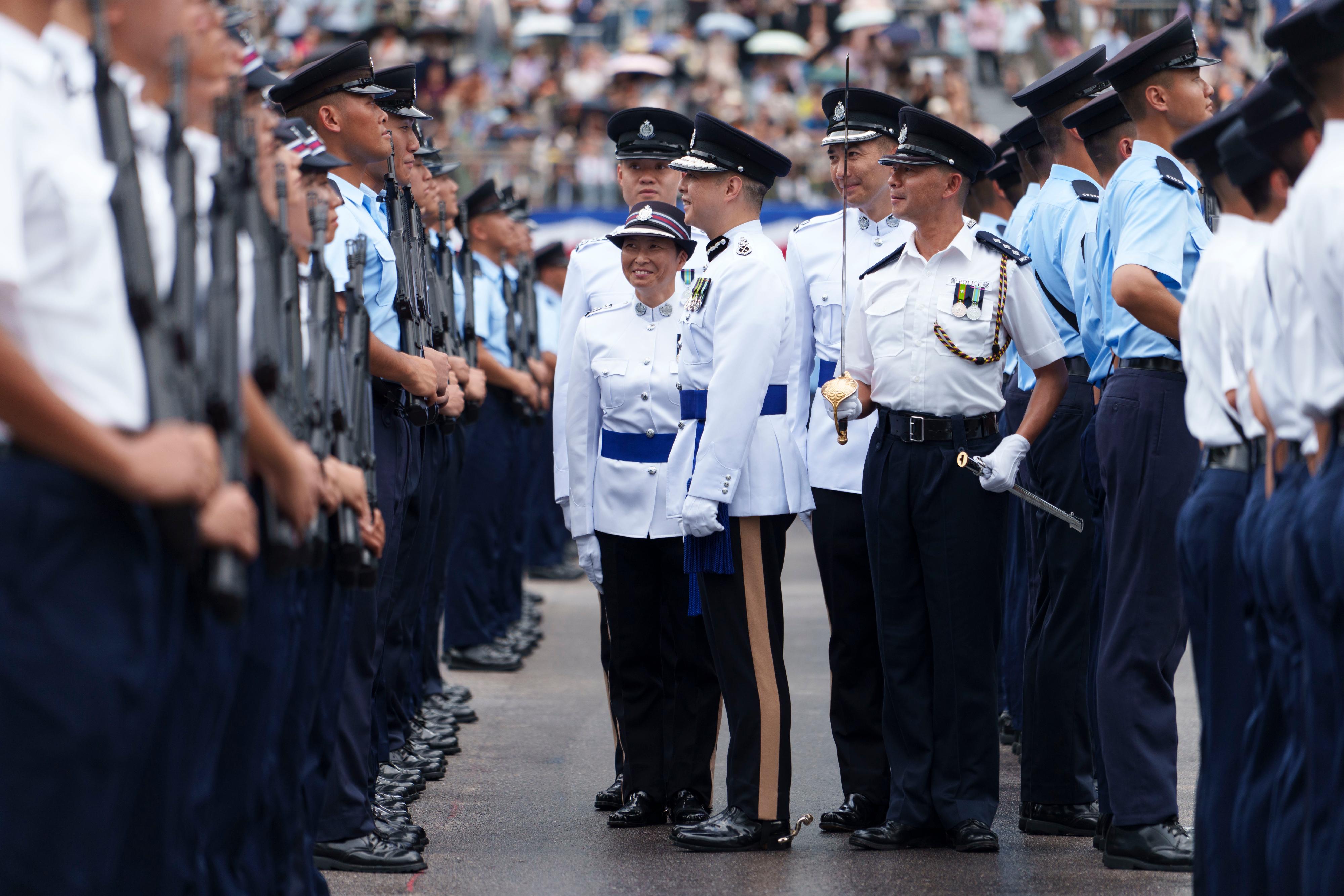 The Commissioner of Police, Mr Chow Yat-ming, inspects a passing-out parade as reviewing officer at the Hong Kong Police College today (July 12).