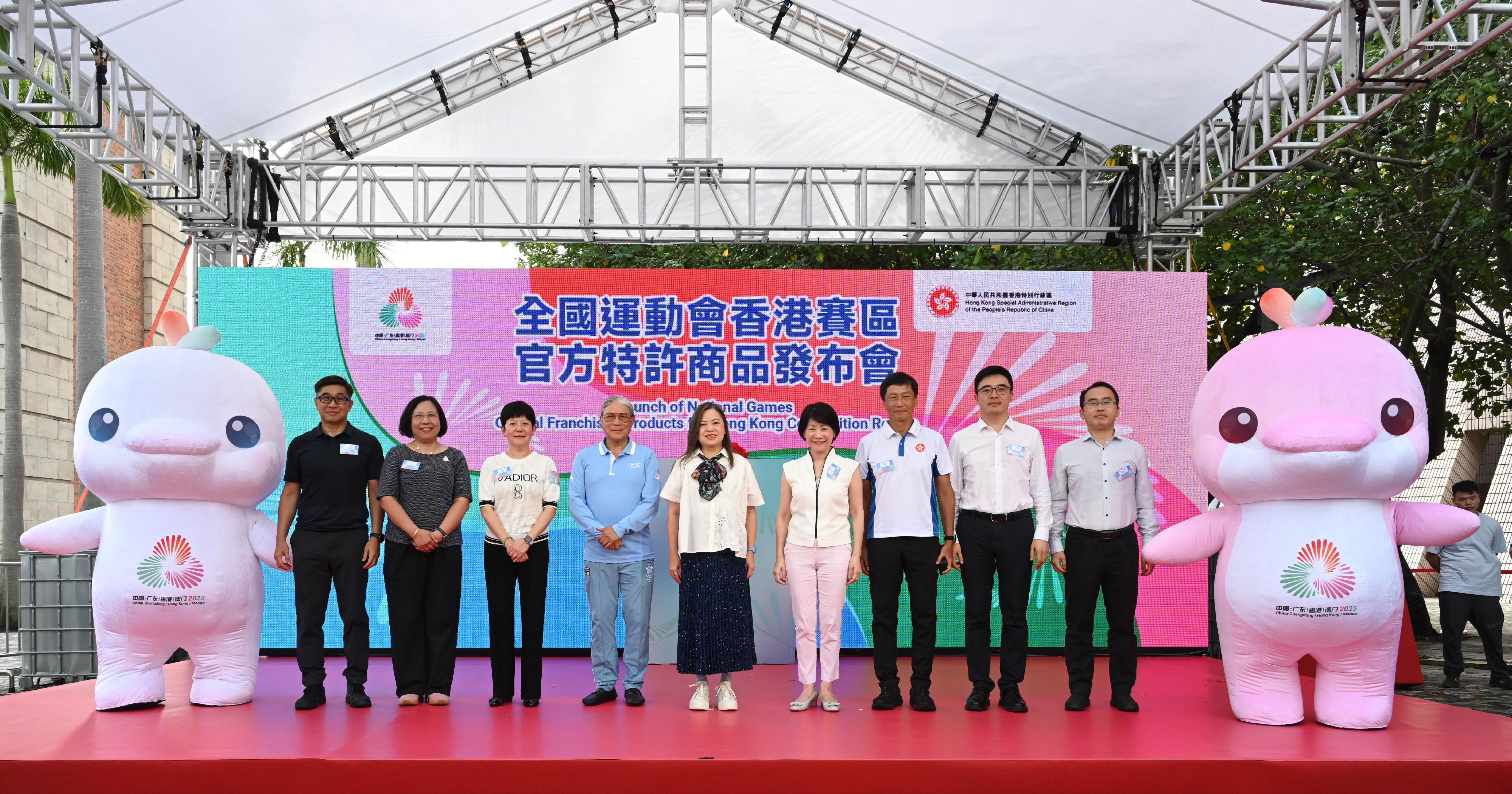 The Launch of National Games Official franchised products for Hong Kong competition region was held at the Hong Kong Cultural Centre Piazza, Tsim Sha Tsui today (July 12). Photo shows the Secretary for Culture, Sports and Tourism, Miss Rosanna Law (centre); the Permanent Secretary for Culture, Sports and Tourism, Ms Vivian Sum (fourth right); the Head of the National Games Coordination Office, Mr Yeung Tak-keung (third right); the Chairmen of the Organising Committee of the Hong Kong Special Administrative Region Delegations to the 15th National Games (NG), the 12th National Games for Persons with Disabilities (NGD) and the 9th National Special Olympic Games (NSOG) Mr Timothy Fok (fourth left) and Mrs Jenny Fung (third left); the Deputy Director-General of the Department of Market Development of the Guangdong Provincial Executive Committees for the 15th NG, the 12th NGD and the 9th NSOG, Mr Liu Xiaochen (second right); the Head of Sports Section of the Department of Publicity, Cultural and Sports Affairs of the Liaison Office of the Central People's Government in the Hong Kong Special Administrative Region, Mr Zhu Jianping (first right), and other guests at the launch ceremony.
