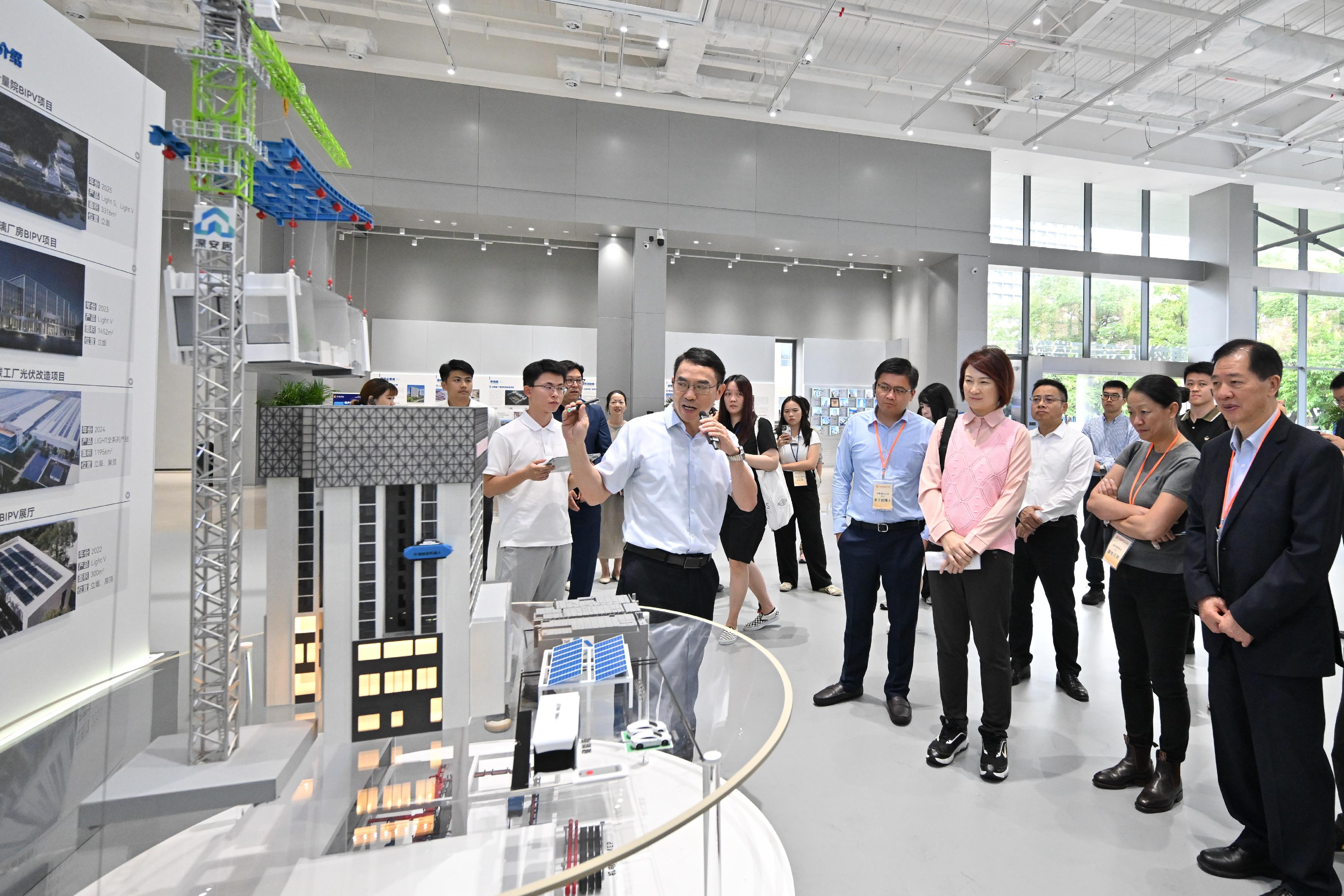 The Working Group on Patriotic Education under the Constitution and Basic Law Promotion Steering Committee organised a two-day exchange tour to the Guangdong-Hong Kong-Macao Greater Bay Area (GBA) on July 12 and 13 to visit various enterprises and places in Shenzhen and Dongguan to learn more about the culture and history of the GBA, as well as the latest developments in areas such as innovation and technology and industrialisation. Photo shows the delegation visiting the China State Construction Hailong Technology Company Limited Science and Technology Research Institute to learn about the operation of the Modular Integrated Construction manufacturing bases.