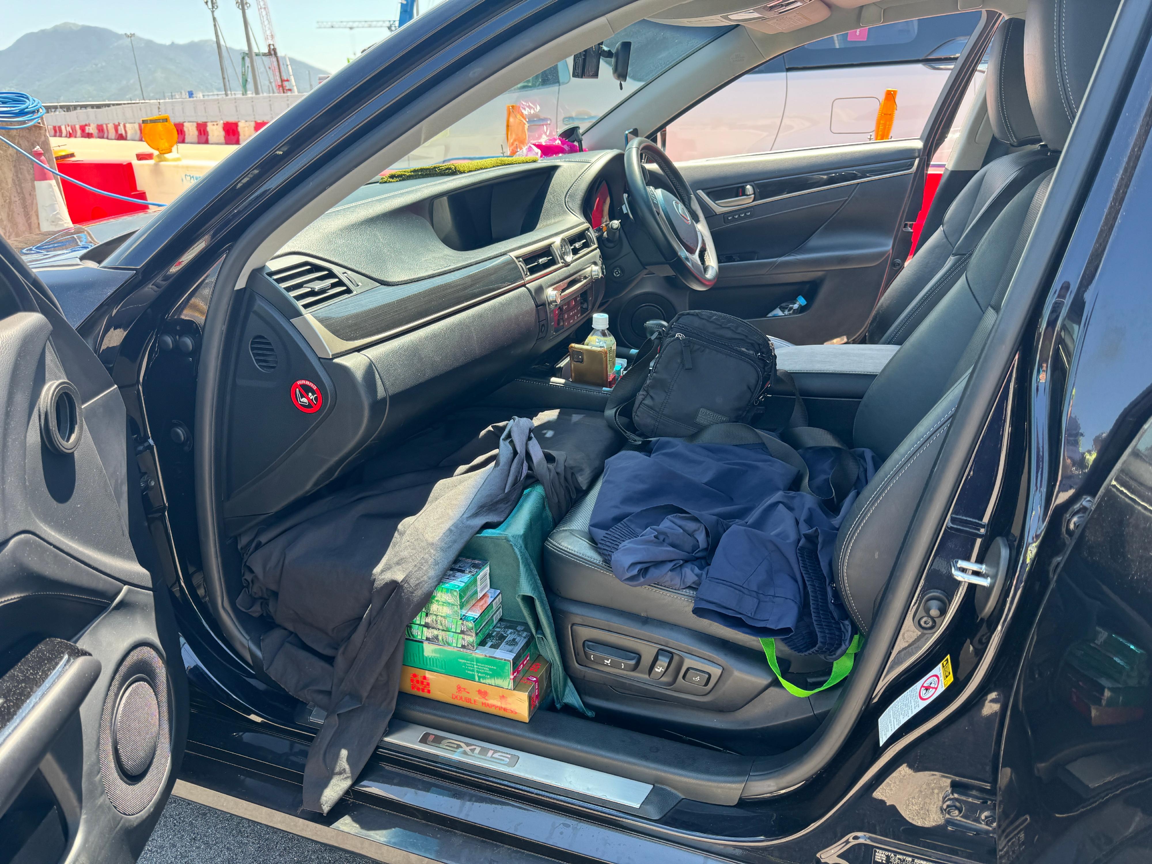 A 59-year-old man was sentenced to 10 months' imprisonment at the West Kowloon Magistrates' Courts on July 10 for importing duty-not-paid cigarettes, in contravention of the Dutiable Commodities Ordinance. Photo shows the duty-not-paid cigarettes seized from the front passenger seat of the man's vehicle.
