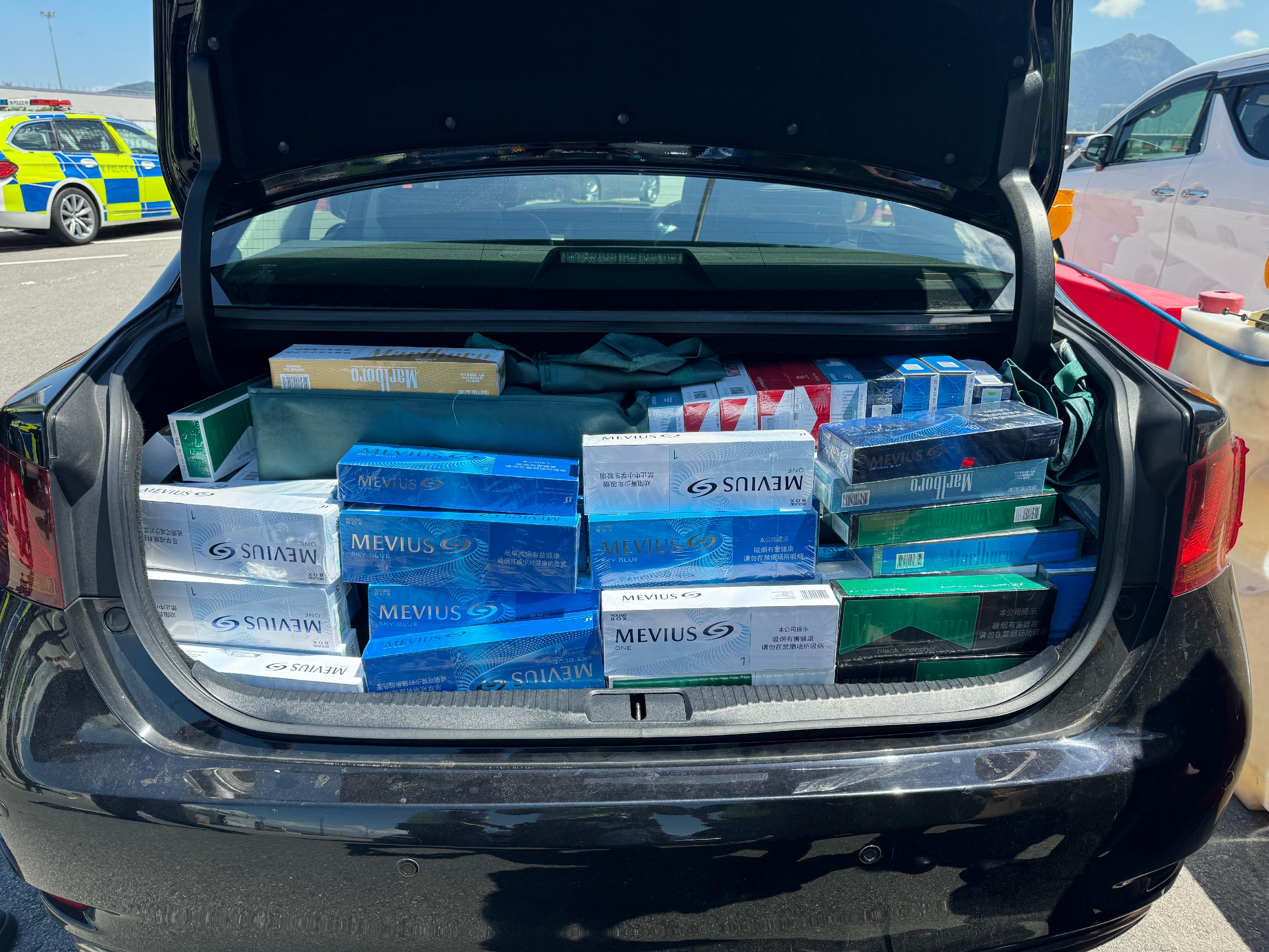 A 59-year-old man was sentenced to 10 months' imprisonment at the West Kowloon Magistrates' Courts on July 10 for importing duty-not-paid cigarettes, in contravention of the Dutiable Commodities Ordinance. Photo shows the duty-not-paid cigarettes seized from the boot of the man's vehicle.
