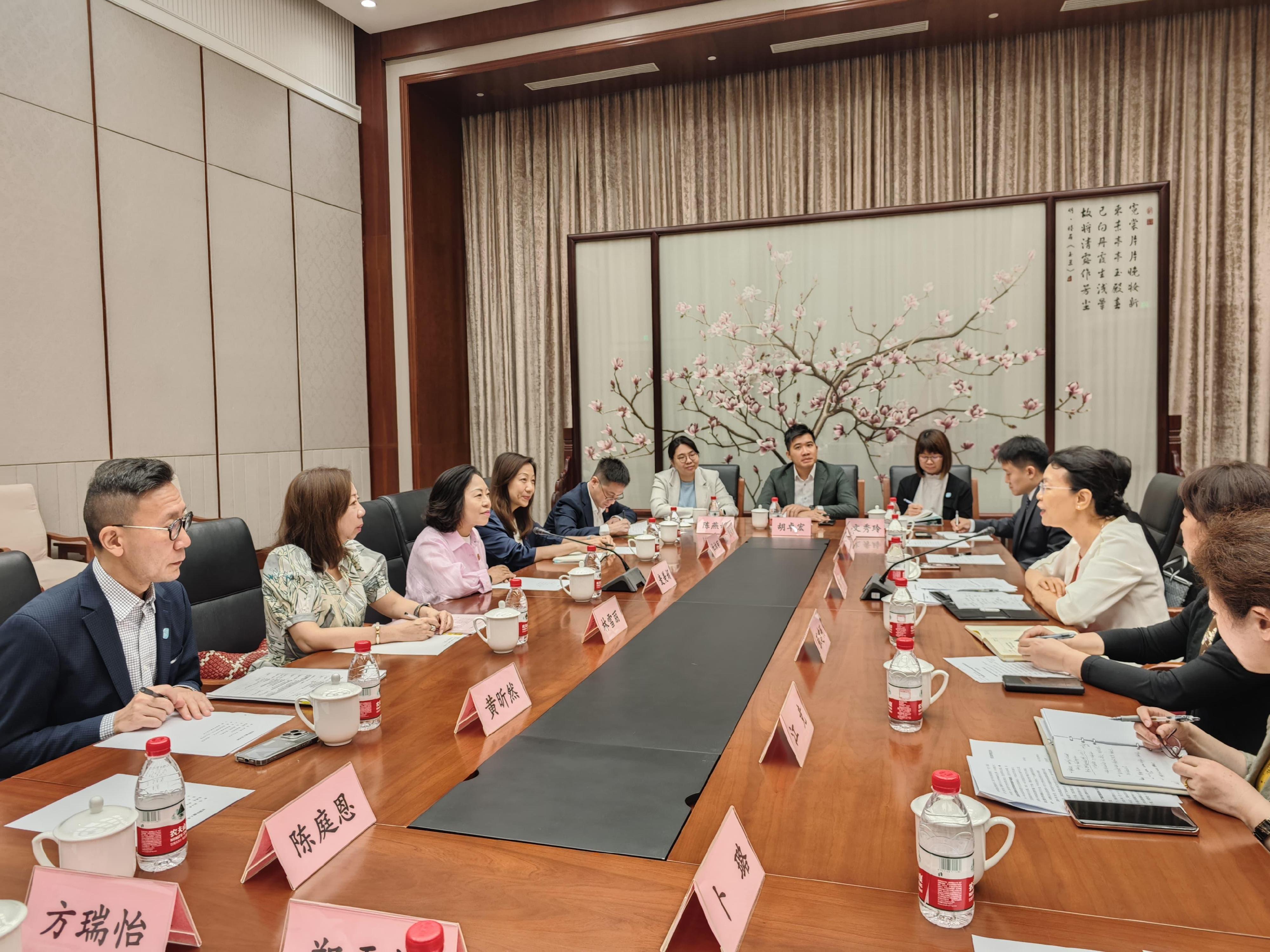 Leading a delegation, the Secretary for Home and Youth Affairs, Miss Alice Mak, commenced her visit to Beijing today (July 14). Photo shows Miss Mak (third left), accompanied by the Permanent Secretary for Home and Youth Affairs, Ms Shirley Lam (second left); the Director of Home Affairs, Ms Priscilla To (fourth left); and the Deputy Secretary for Home and Youth Affairs (Home Affairs), Mr Paul Wong (first left), meeting with the Vice-President of the All-China Women's Federation, Ms Lin Yi (third right).