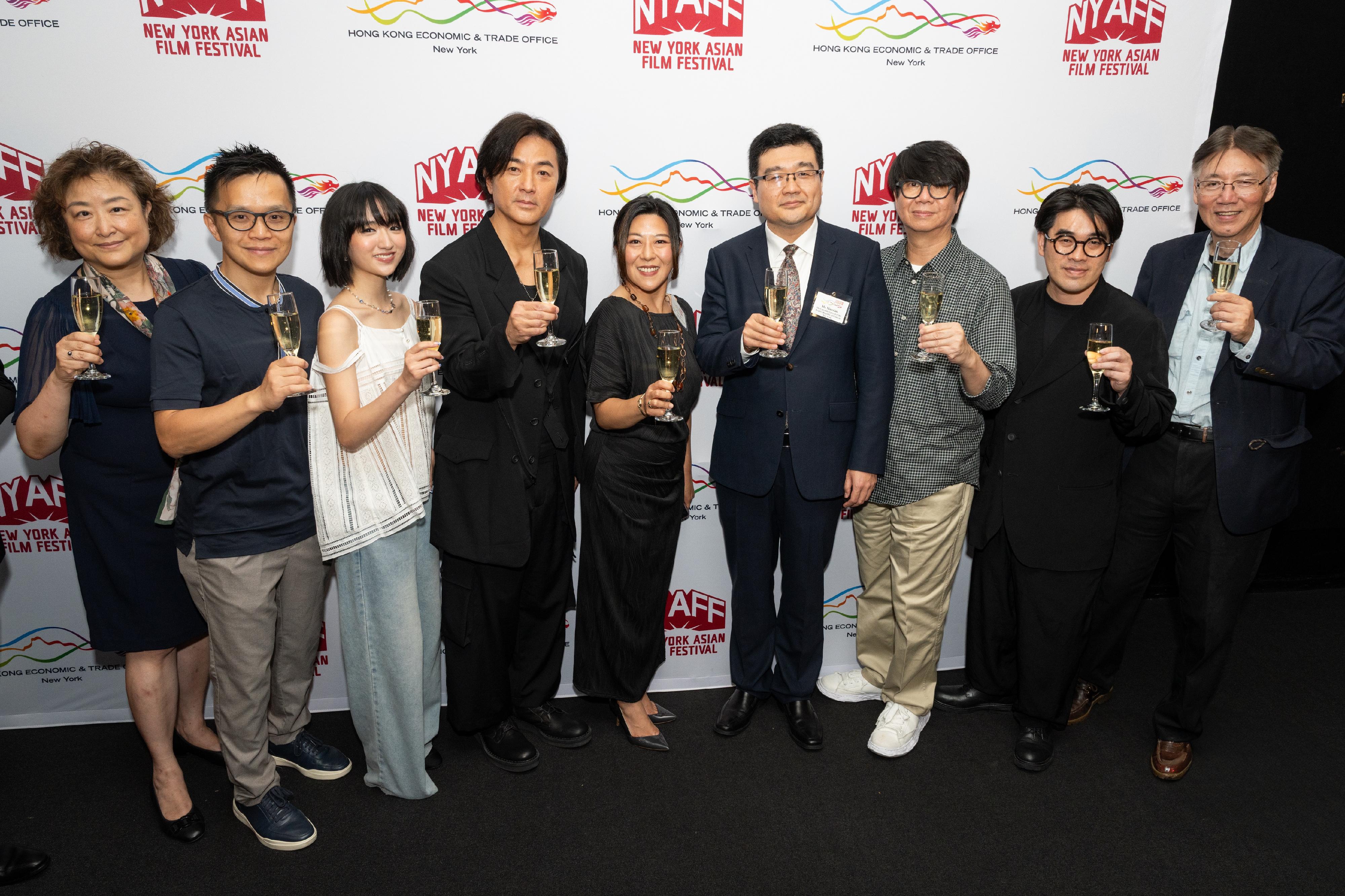 The Hong Kong Economic and Trade Office in New York (New York ETO) hosted a special reception at the New York Asian Film Festival on July 14 (New York time) in honour of the visiting Hong Kong film talent participating in this year's event. Photo shows the Director of the New York ETO, Ms Maisie Ho (fifth left), with other officiating guests and Hong Kong film talent proposing a toast.