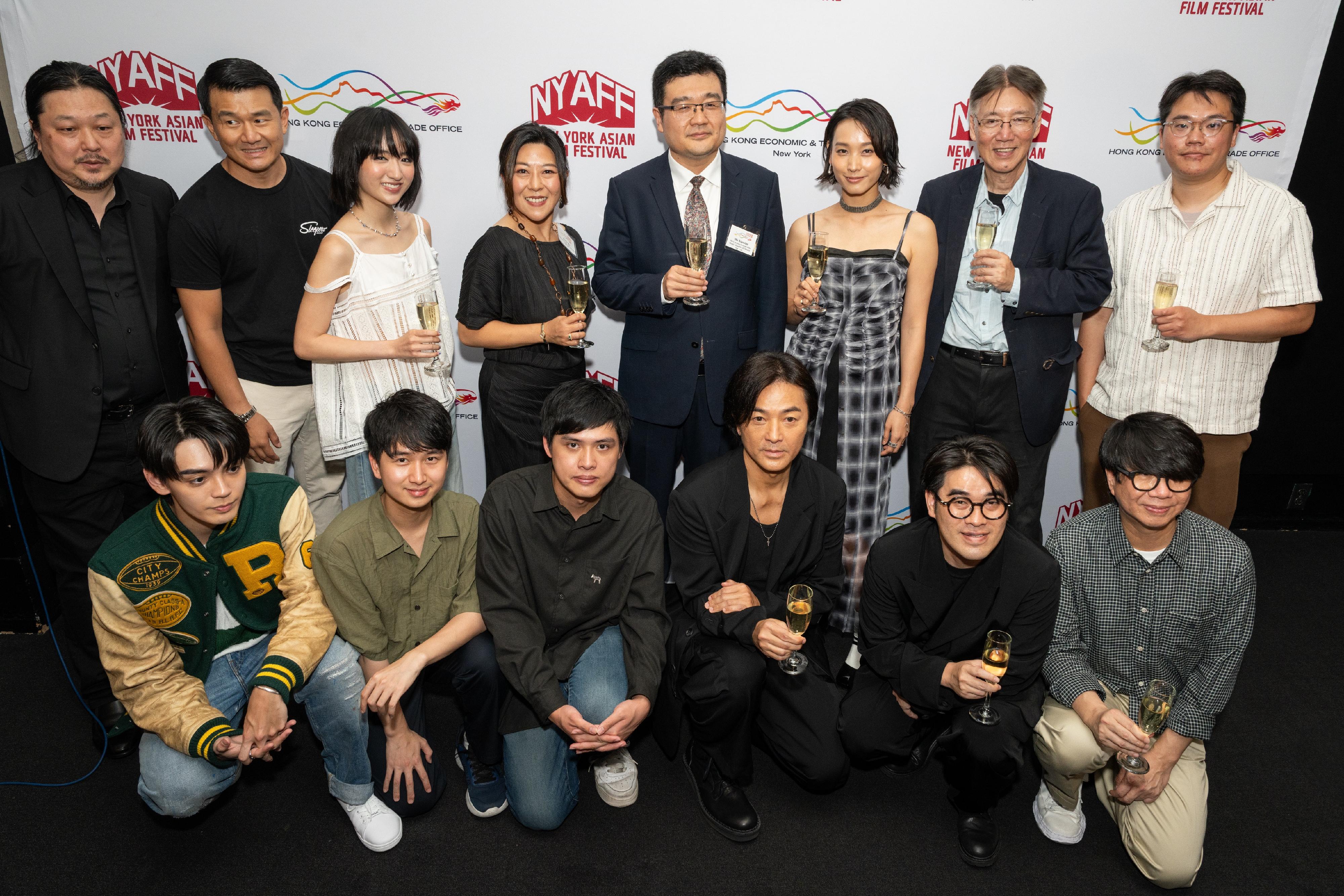 The Hong Kong Economic and Trade Office in New York (New York ETO) hosted a special reception at the New York Asian Film Festival on July 14 (New York time) in honour of the visiting Hong Kong film talent participating in this year's event. Photo shows the Director of the New York ETO, Ms Maisie Ho (back row, fourth left), with other officiating guests and Hong Kong film talent proposing a toast.