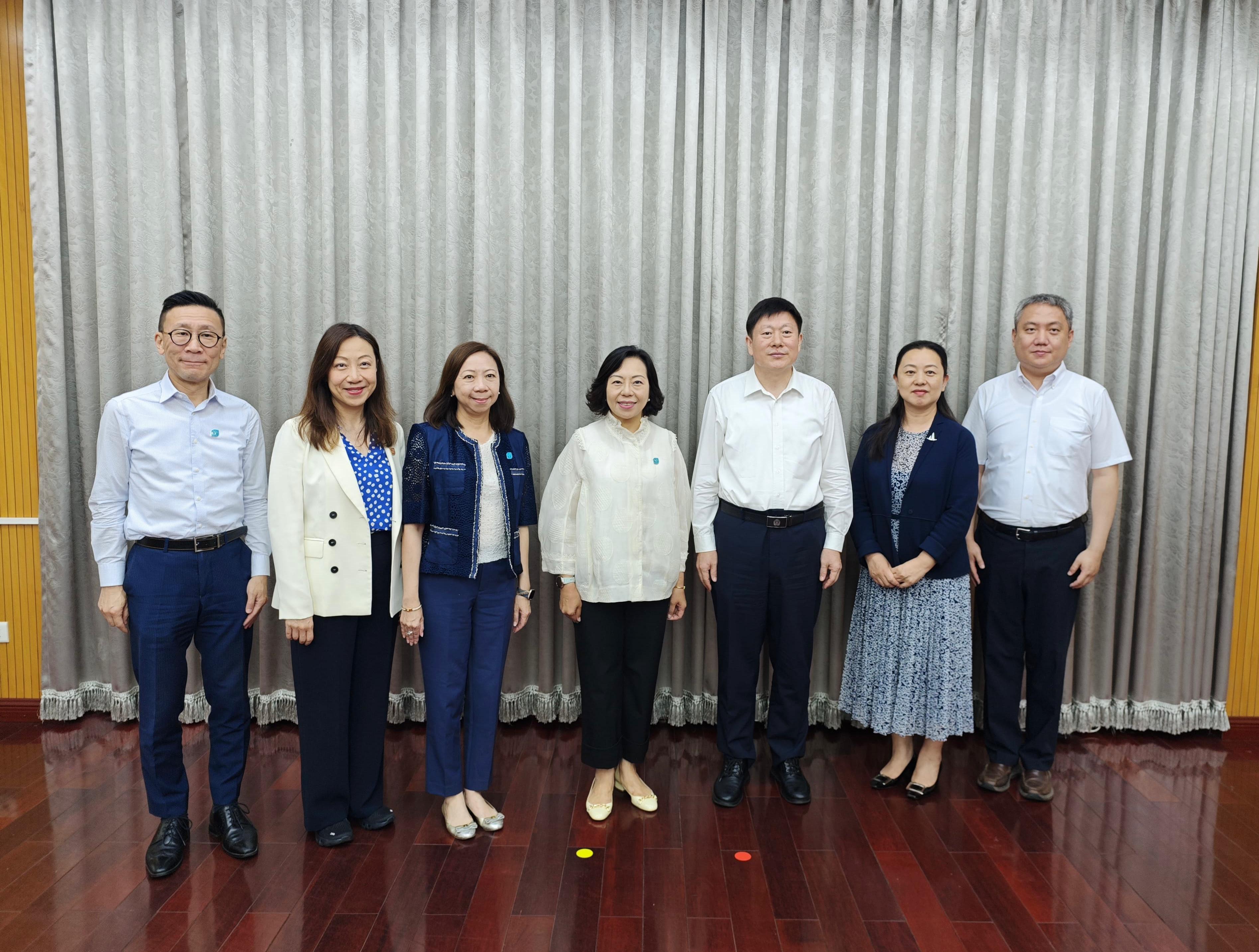 The Secretary for Home and Youth Affairs, Miss Alice Mak, continued her visit to Beijing today (July 15). Photo shows Miss Mak (centre), accompanied by the Permanent Secretary for Home and Youth Affairs, Ms Shirley Lam (third left); the Director of Home Affairs, Ms Priscilla To (second left); and the Deputy Secretary for Home and Youth Affairs (Home Affairs), Mr Paul Wong (first left), meeting with the Vice Minister of the Society Work Department of the Communist Party of China Central Committee, Mr He Zhiliang (third right).