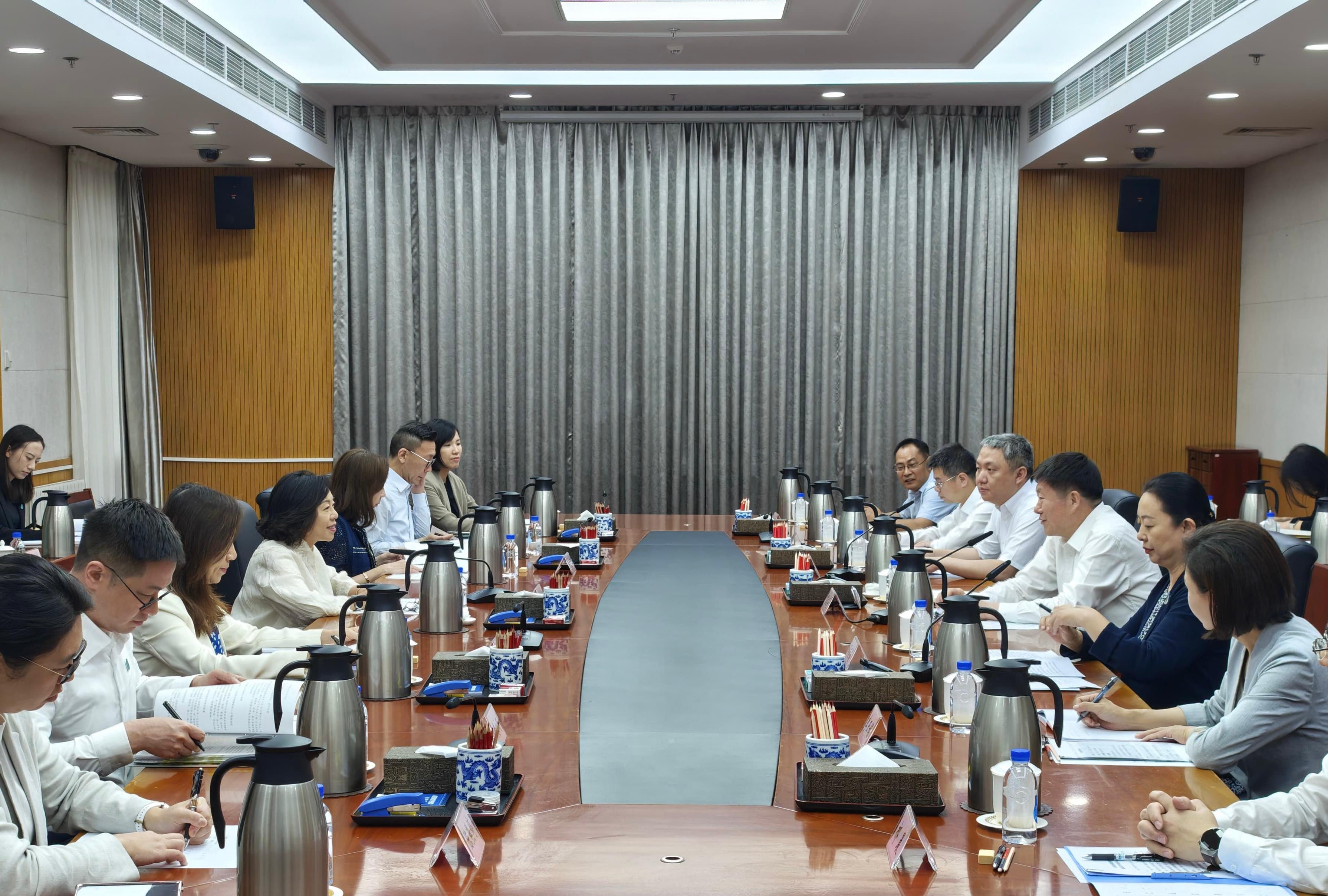 The Secretary for Home and Youth Affairs, Miss Alice Mak, continued her visit to Beijing today (July 15). Photo shows Miss Mak (fourth left) meeting with the Vice Minister of the Society Work Department of the Communist Party of China Central Committee, Mr He Zhiliang (third right).