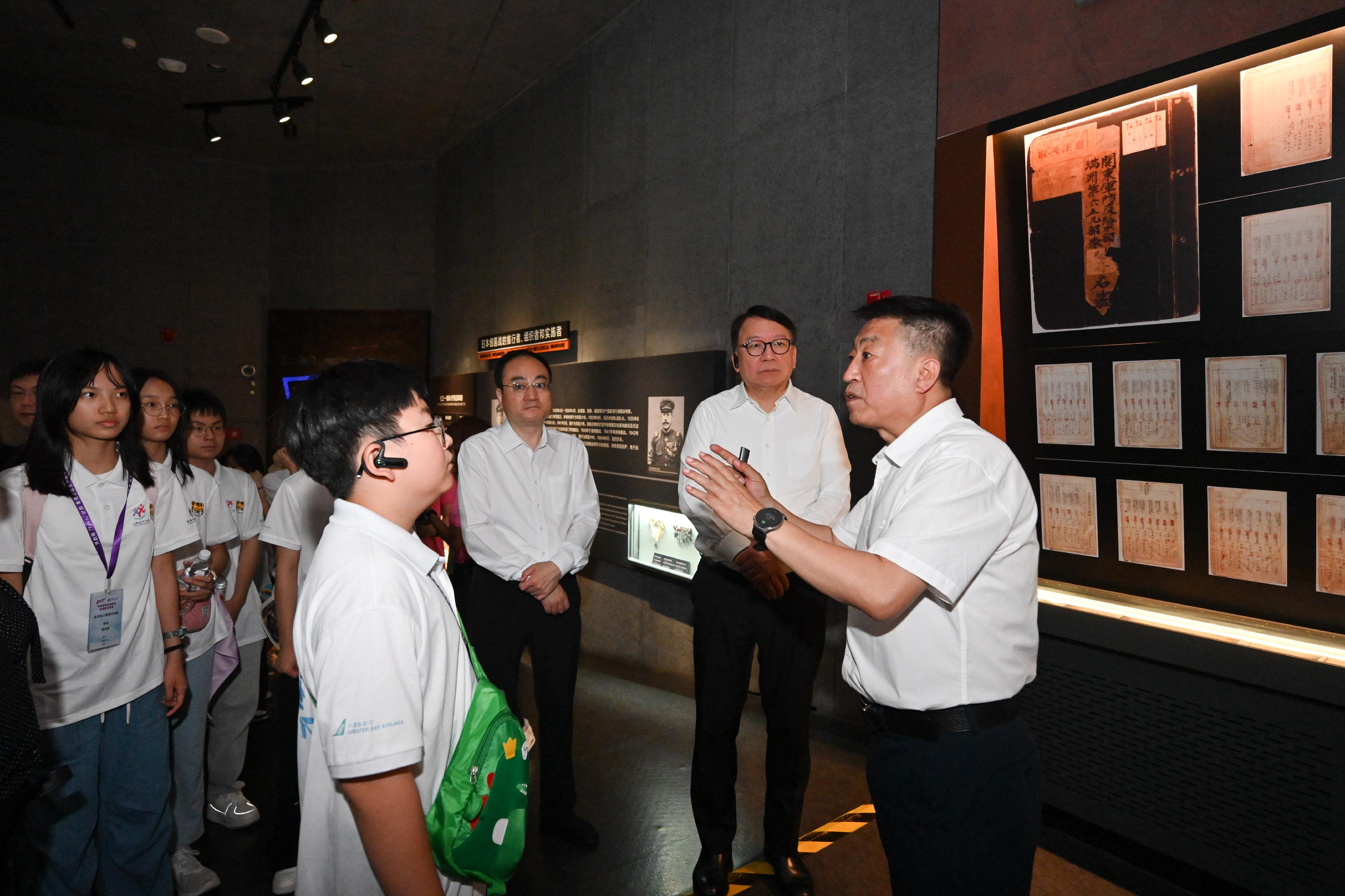 The Chief Secretary for Administration, Mr Chan Kwok-ki, continued his visit to Heilongjiang Province today (July 16). Photo shows Mr Chan (second right) and members of the Hong Kong Patriotic Education Heilongjiang Study Tour under the Strive and Rise Programme visiting the Exhibition Hall of Evidences of Crime Committed by Unit 731 of the Japanese Imperial Army, and being briefed by a staff member.