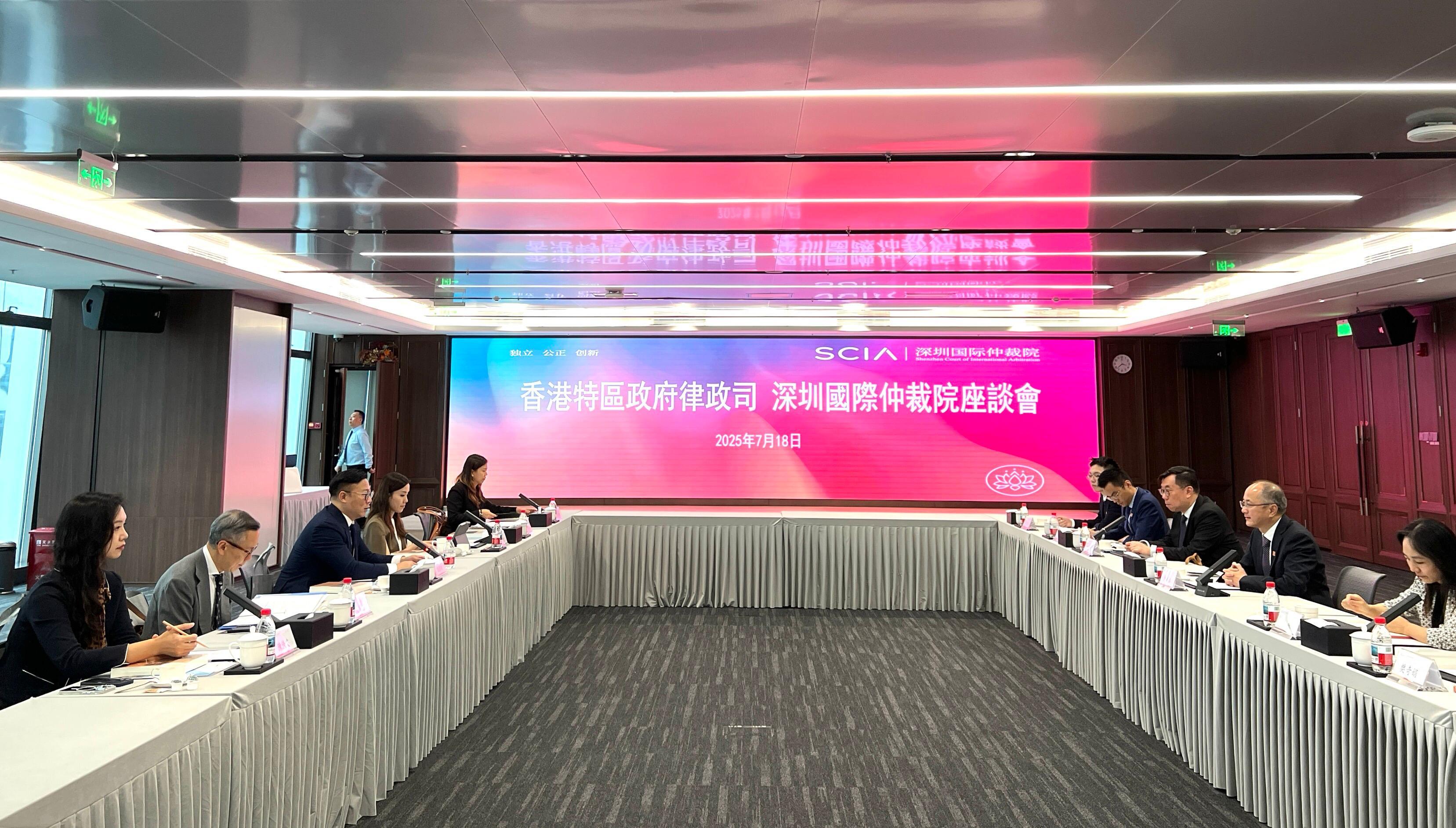 The Deputy Secretary for Justice, Dr Cheung Kwok-kwan, met with the President of the Shenzhen Court of International Arbitration, Dr Liu Xiaochun, in Shenzhen today (July 18) to discuss developments and collaboration in the field of sports dispute resolution between Hong Kong and Shenzhen. Photo shows Dr Cheung (third left) and Dr Liu (second right) exchanging views at the meeting.