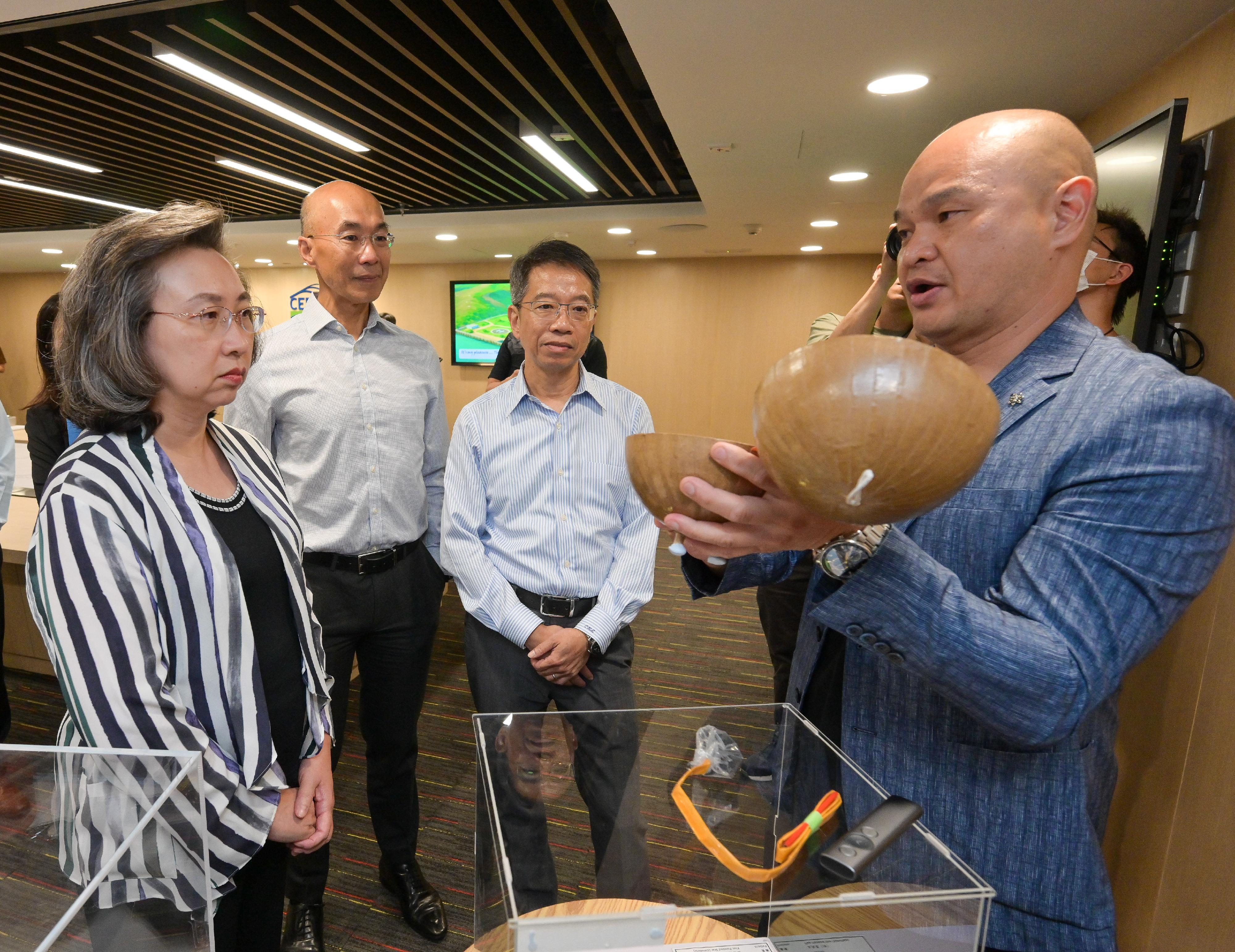 The Secretary for the Civil Service, Mrs Ingrid Yeung, visited the Civil Engineering and Development Department (CEDD) this afternoon (July 18) to learn about the department's latest progress in optimising operational efficiency and services through the application of technology, as well as its work in landslip prevention and mitigation and slope safety. Photo shows CEDD Mines Division staff introducing to Mrs Yeung (first left) the work of monitoring explosives and blasting, including the use of aerial shell in fireworks displays. Looking on are the Permanent Secretary for the Civil Service, Mr Clement Leung (second right), and the Director of Civil Engineering and Development, Mr Michael Fong (second left).