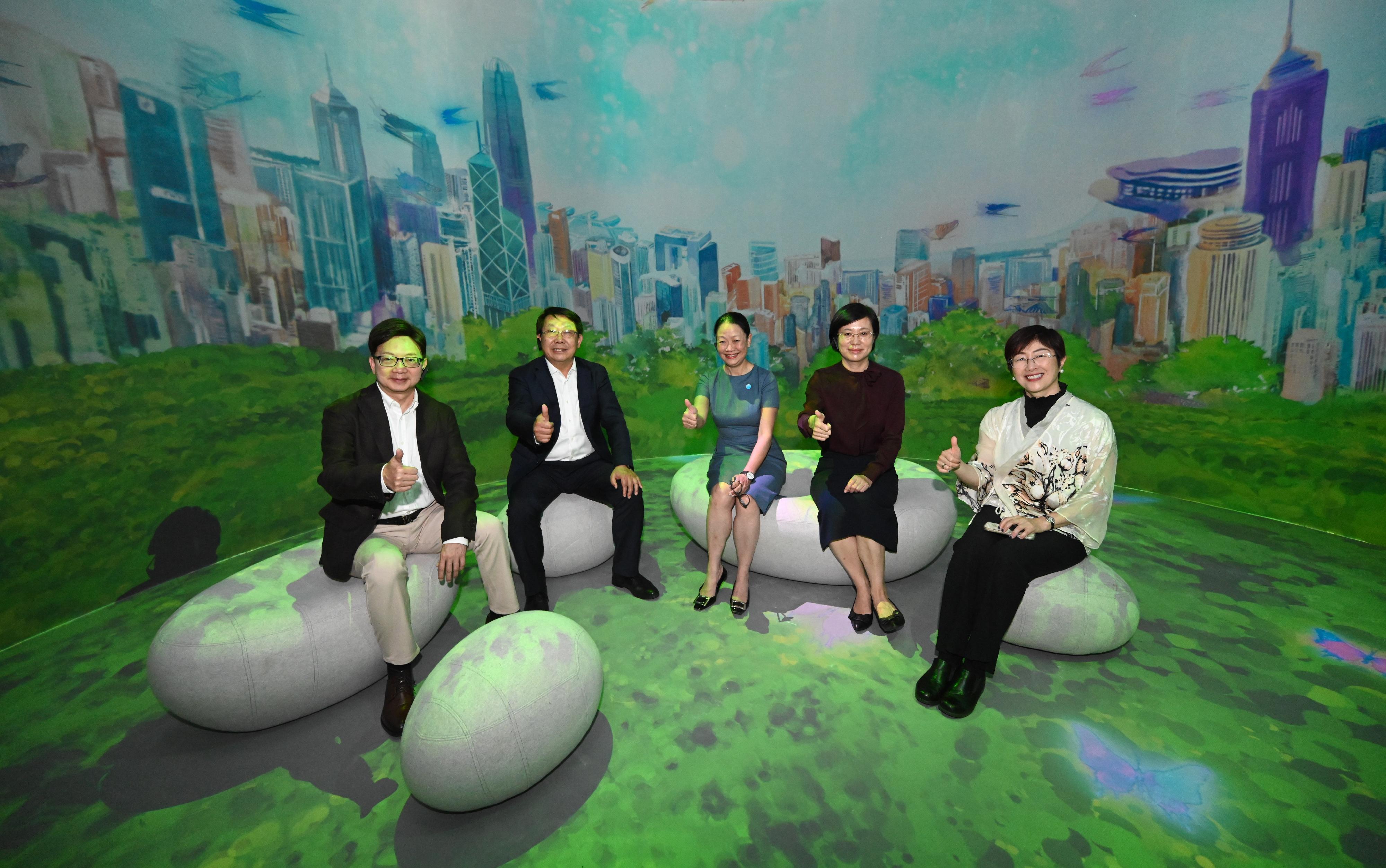 The "Immersive Hong Kong" roving exhibition, which showcases the diversity and latest developments of Hong Kong through interactive art technology, opened in Qingdao today (July 18). The exhibition invites visitors from Qingdao and the entire Shandong Province to explore the unique opportunities and potential for tourism, education, business and investment in Hong Kong. Photo shows (from left) the Director of the Shandong Liaison Unit of the Hong Kong Special Administrative Region Government, Mr Gary Wong; the Director of the Hong Kong and Macao Affairs Office of Shandong Provincial People's Government, Mr Zhang Liansan; the Director of Information Services, Mrs Apollonia Liu; Vice Mayor of the Qingdao Municipal People's Government Ms Zhao Yan; and the Director of the Hong Kong Economic and Trade Office in Shanghai, Mrs Laura Aron, touring the exhibition.