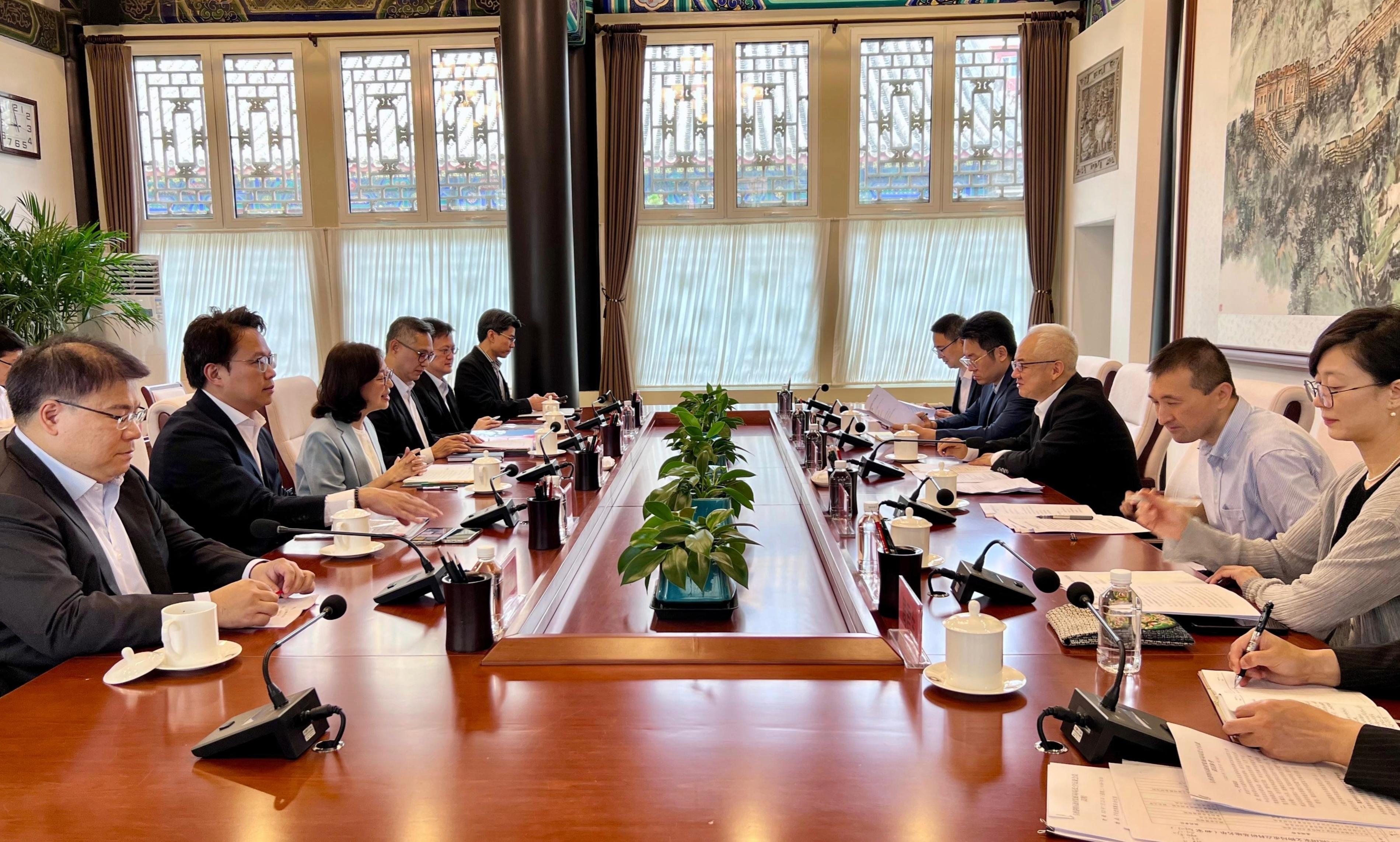 The Secretary for Development, Ms Bernadette Linn, began her visit to Beijing today (July 23). Photo shows Ms Linn (third left); and the Permanent Secretary for Development (Works), Mr Ricky Lau (fourth left), meeting with Deputy Administrator of the National Cultural Heritage Administration Mr Qiao Yunfei (third right).
