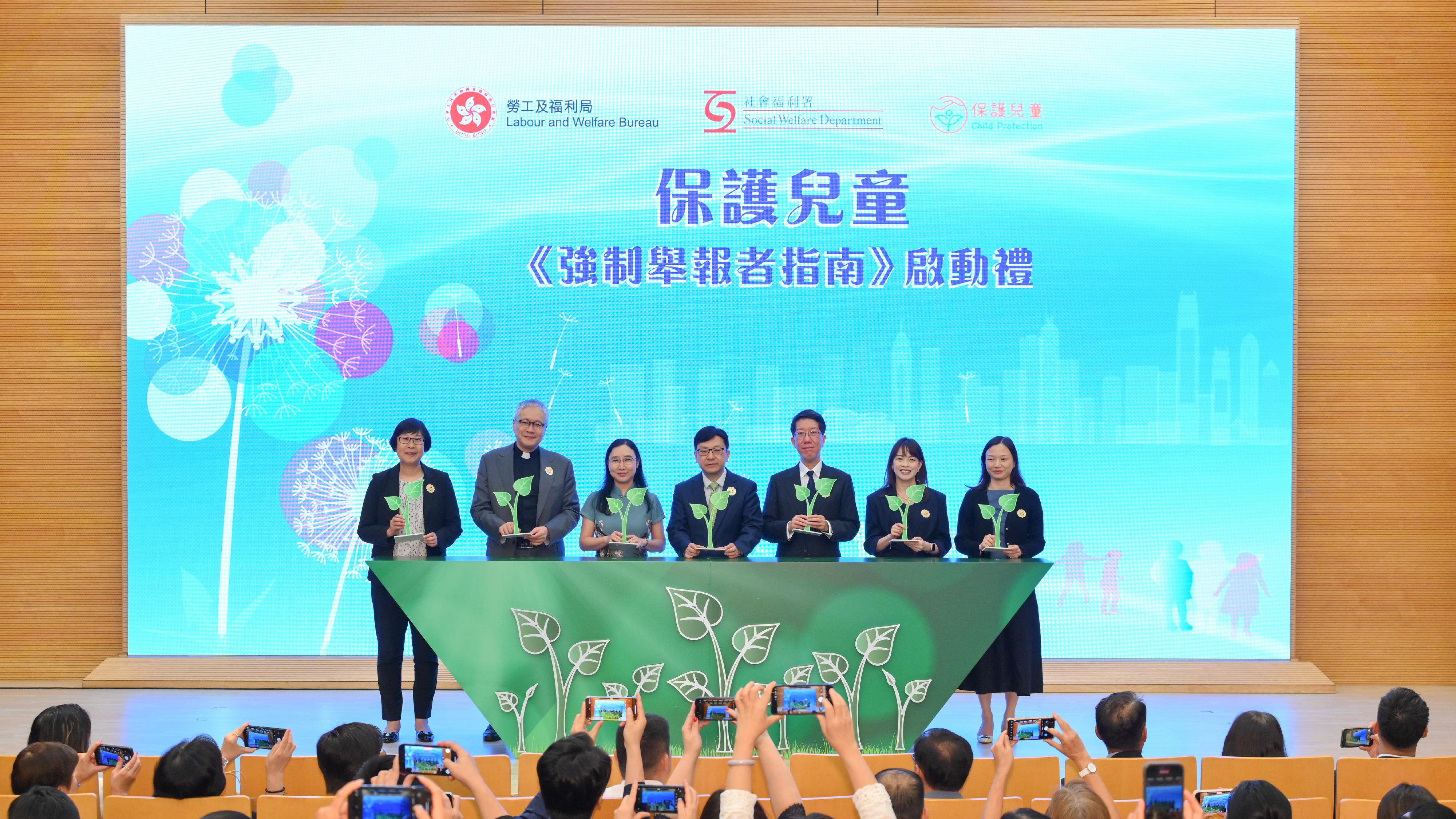 The Secretary for Labour and Welfare, Mr Chris Sun, officiated at Child Protection - Launching Ceremony of the Guide for Mandated Reporters today (July 24) to announce the official launch of the Guide for mandated reporters' reference. Photo shows Mr Sun (centre), accompanied by the Permanent Secretary for Labour and Welfare, Ms Alice Lau (third left), and the Director of Social Welfare, Mr Edward To (third right), officiating the launch of the Guide with the Chairman of the Legislative Council Panel on Welfare Services, Reverend Canon Peter Douglas Koon (second left); Deputy Secretary for Health Ms Elaine Mak (second right); the Assistant Commissioner of Police (Crime), Ms Chung Wing-man (first left); and the Acting Principal Assistant Secretary (Special Education) of the Education Bureau, Ms Candy Chan (first right).