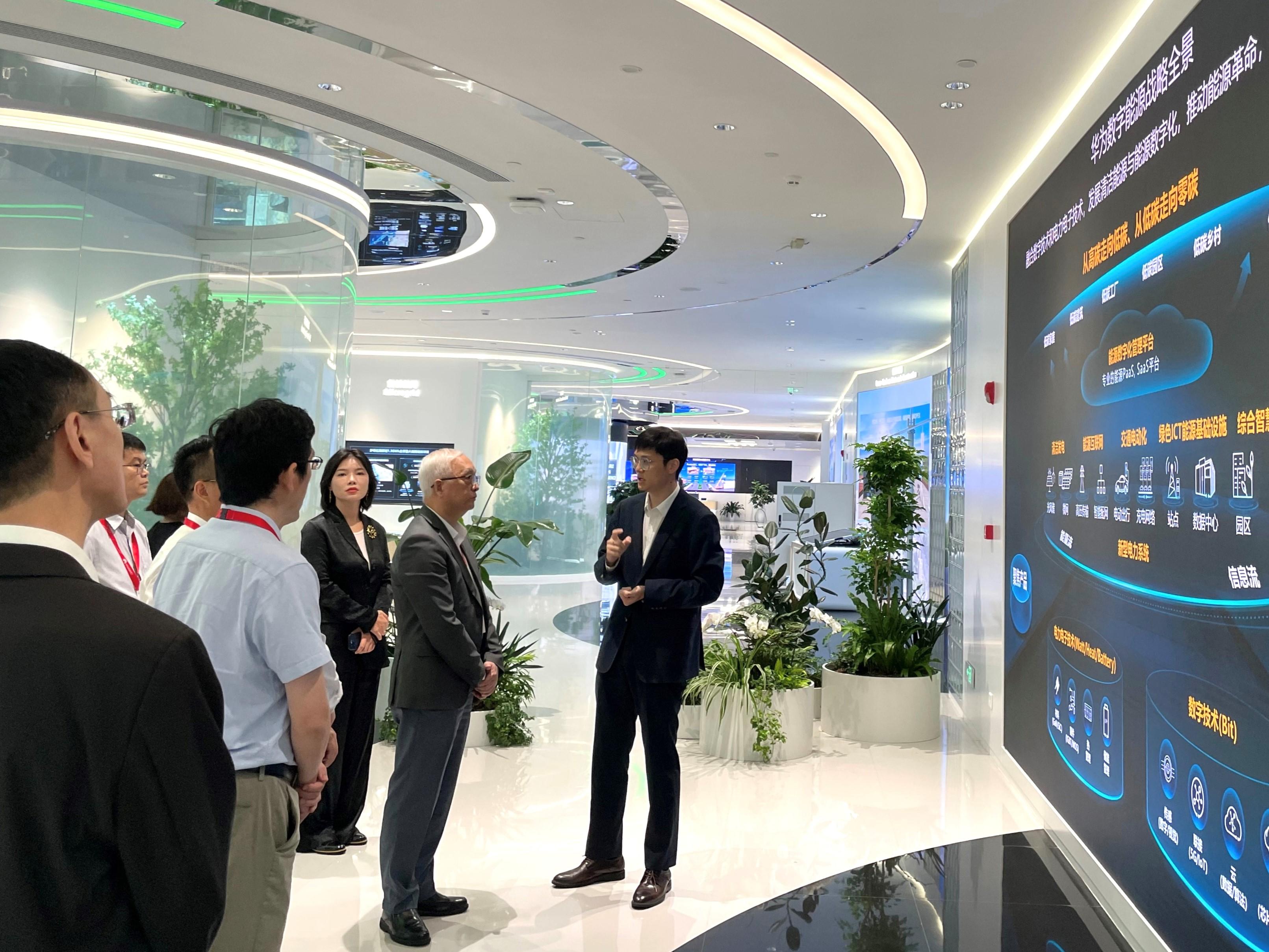 The Secretary for Environment and Ecology, Mr Tse Chin-wan, and officials of the Environment and Ecology Bureau visited Shenzhen today (July 24) to learn more about its charging infrastructure. Photo shows Mr Tse (second right) being briefed by a staff member of Huawei Digital Power Technologies Co, Ltd on the latest developments of the company.
