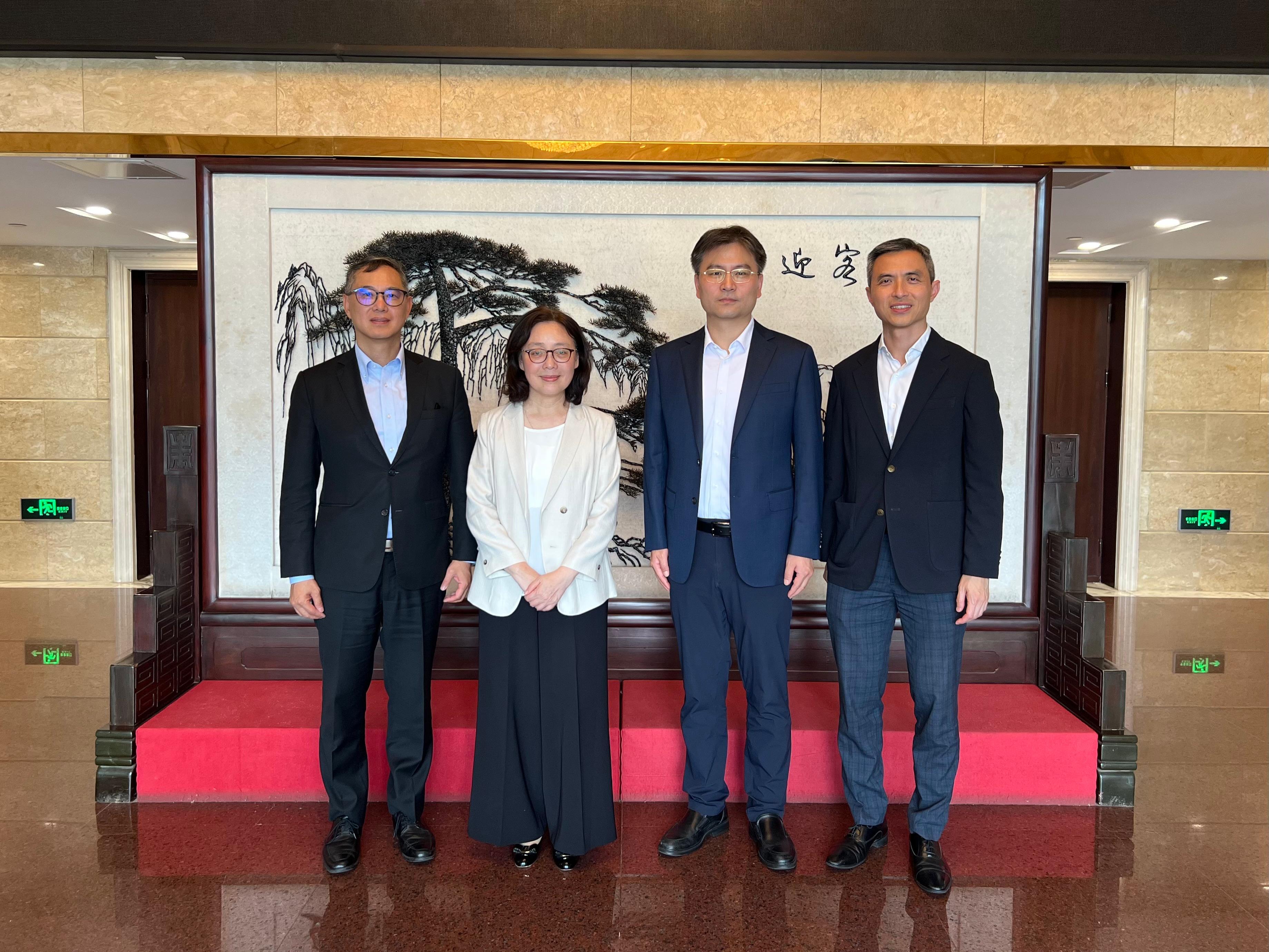 The Secretary for Development, Ms Bernadette Linn, continued her visit to Beijing today (July 24). Photo shows Ms Linn (second left); Deputy Director-General of the Bureau of International Cooperation of the State-owned Assets Supervision and Administration Commission of the State Council Mr Xie Hui (second right); the Permanent Secretary for Development (Works), Mr Ricky Lau (first left); and the Director of the Northern Metropolis Co-ordination Office, Mr Vic Yau (first right).