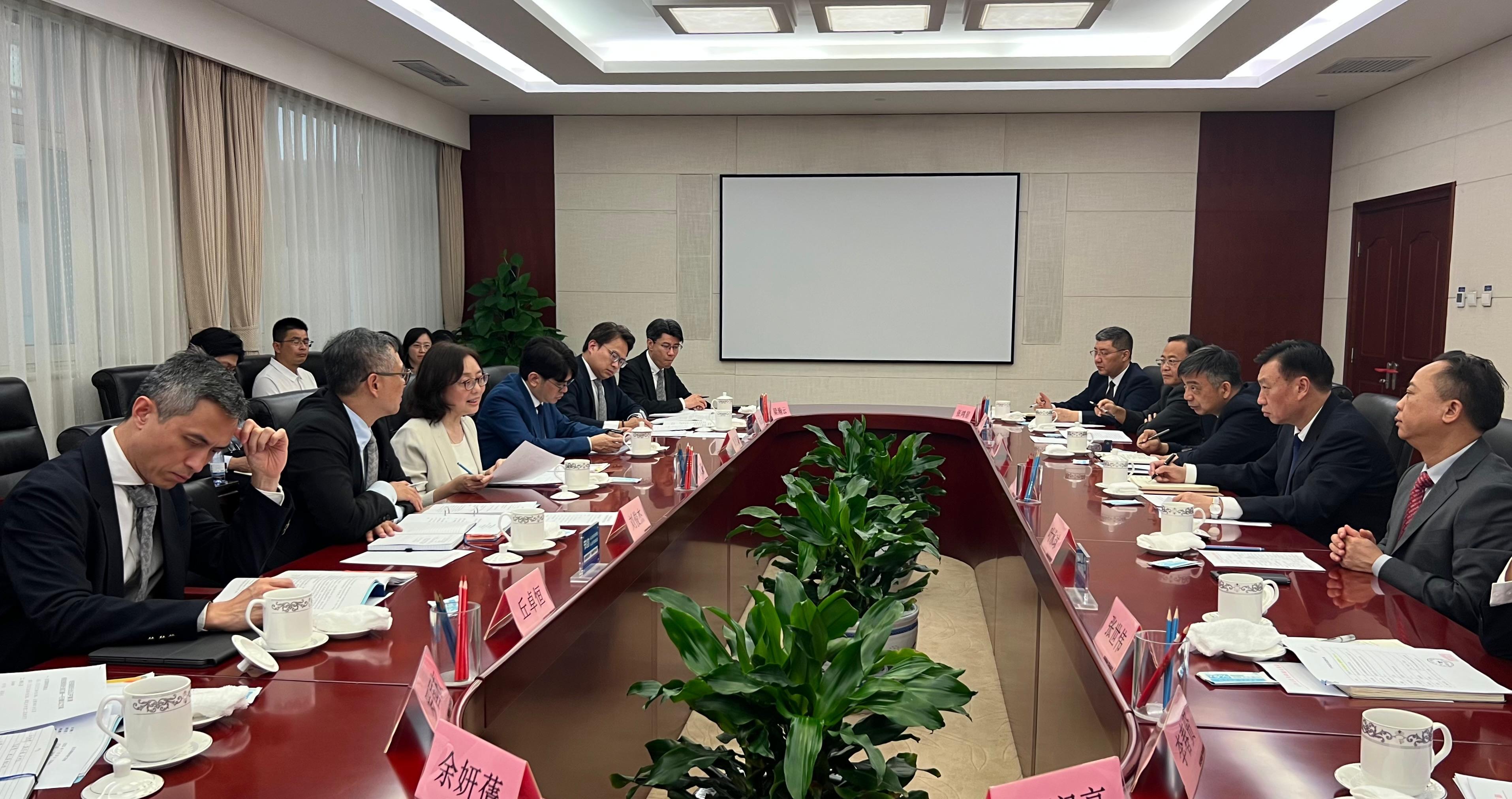 The Secretary for Development, Ms Bernadette Linn, continued her visit to Beijing today (July 24). Photo shows Ms Linn (third left) meeting with Vice Minister of Water Resources, Mr Liu Dongshun (second right). The Permanent Secretary for Development (Works), Mr Ricky Lau (second left); and the Director of the Northern Metropolis Co-ordination Office, Mr Vic Yau (first left), also attended.