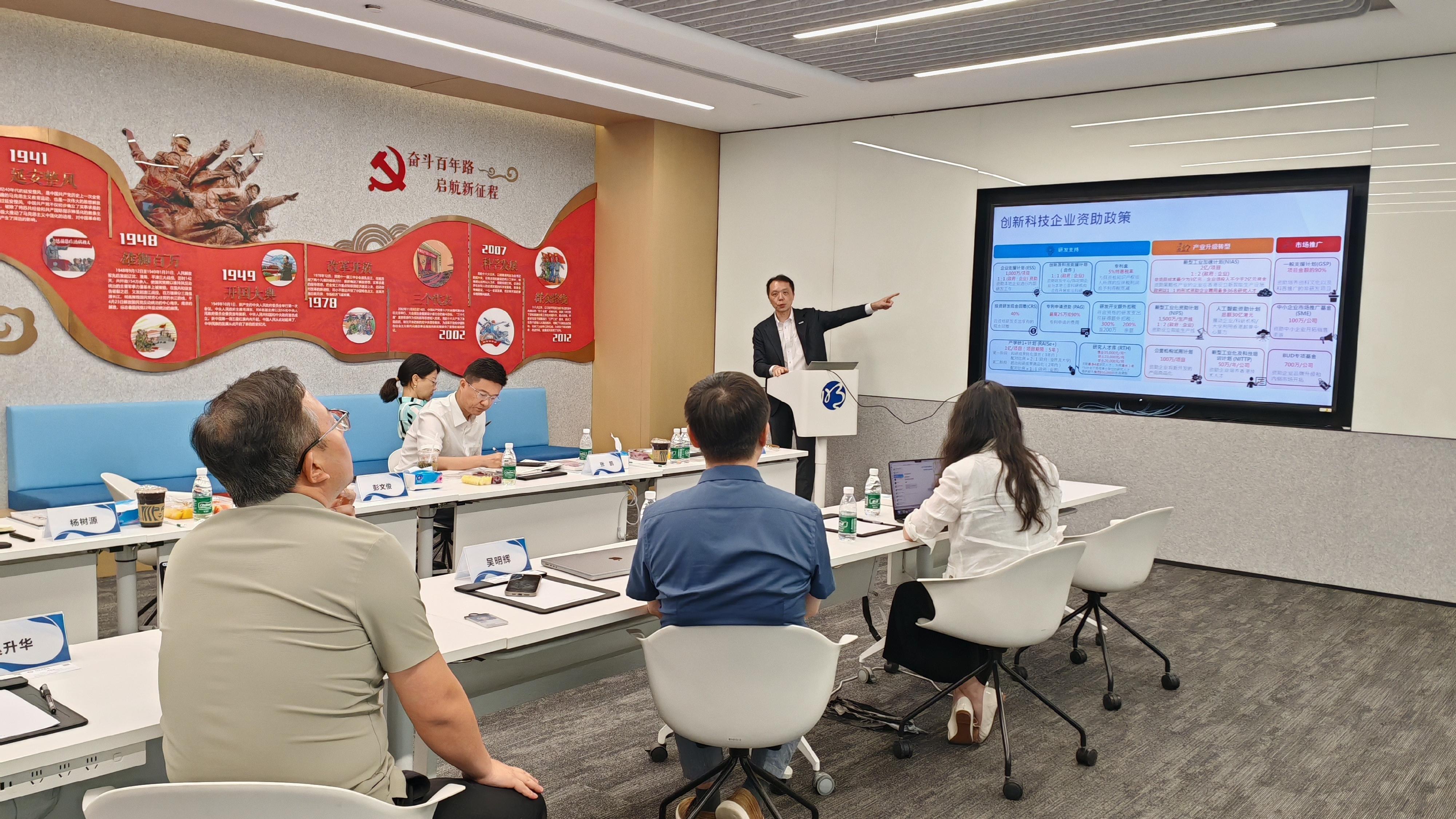 The Director-General of the Office for Attracting Strategic Enterprises (OASES), Mr Peter Yan, today (July 25) concluded his visit to Beijing. Photo shows the Executive Director of OASES, Mr Bryan Peng (middle), introducing the support measures offered by OASES to facilitate business establishment and expansion in Hong Kong.