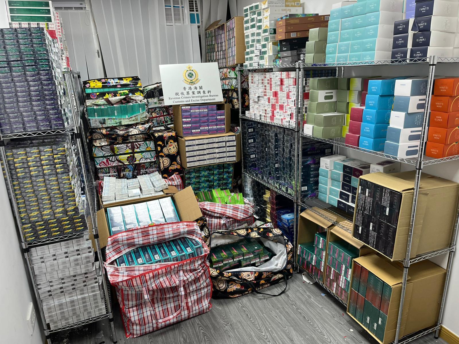 Hong Kong Customs shut down two suspected illicit cigarette and alternative smoking product storage centres in San Po Kong yesterday (July 24), seizing a total of about 650 000 suspected illicit cigarettes and about 720 000 suspected alternative smoking products, with a total estimated market value of about $5.2 million. The duty potential of the illicit cigarettes was about $2.15 million. One person involved in the case was arrested. Photo shows a suspected illicit cigarette and alternative smoking product storage centre and some of the suspected illicit cigarettes and alternative smoking products seized.