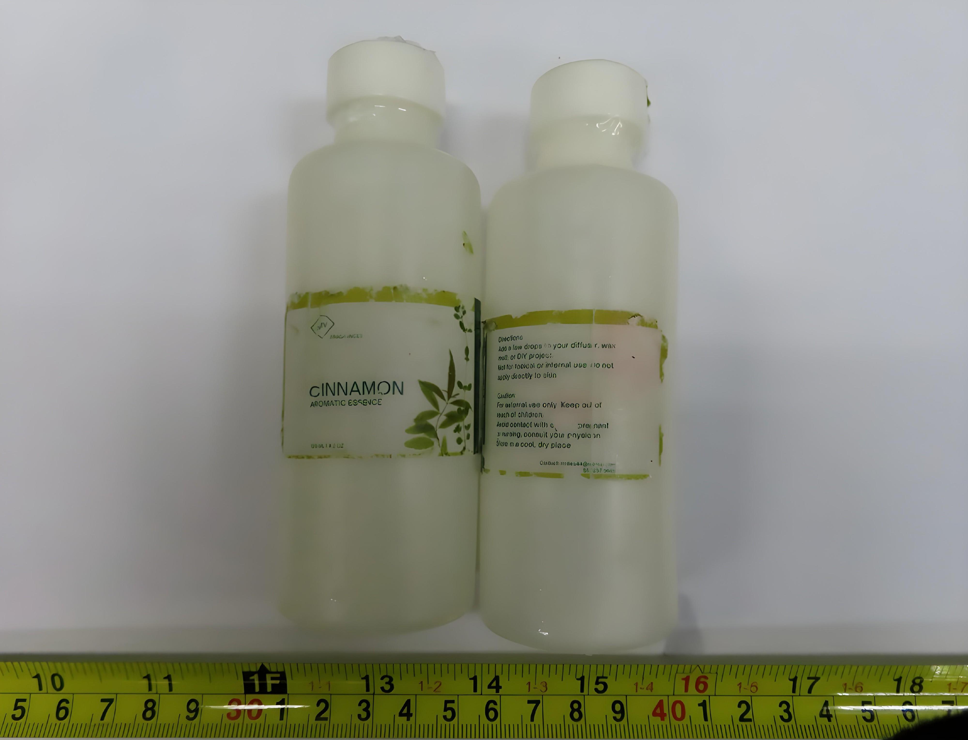 Hong Kong Customs yesterday (July 25) and today (July 26) seized about 28 kilograms of suspected liquid methamphetamine with an estimated market value of about $15 million at Hong Kong International Airport. Photo shows some of the seized suspected liquid methamphetamine found inside plastic bottles of aromatic essence.