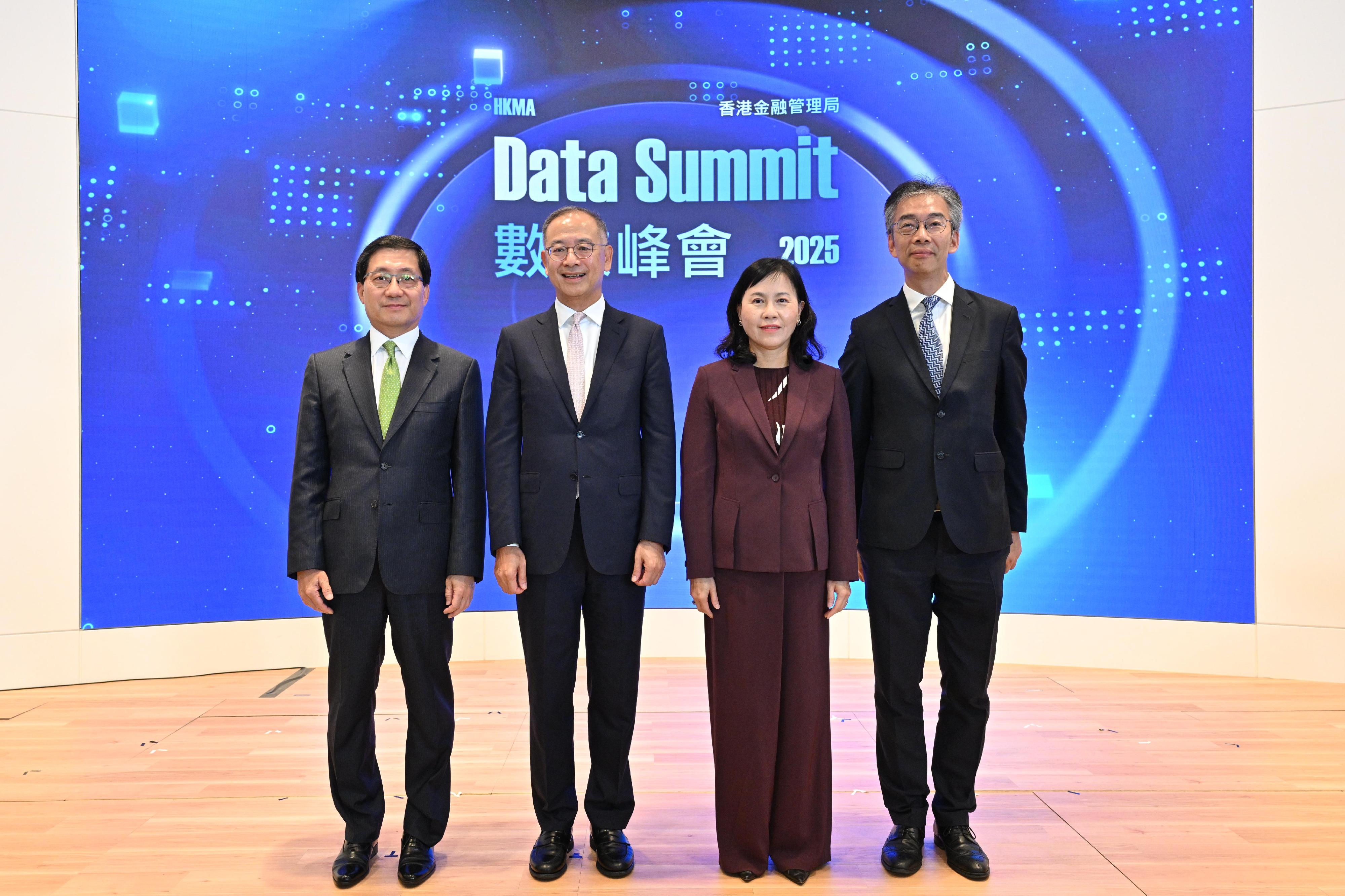 The Chief Executive of the Hong Kong Monetary Authority, Mr Eddie Yue (second left); the Secretary for Transport and Logistics, Ms Mable Chan (second right); the Chairman of the Airport Authority Hong Kong, Mr Fred Lam (first left), and the Deputy Commissioner (Data Governance) of the Digital Policy Office, Mr Donald Mak (first right), jointly officiate the opening ceremony of the Data Summit today (July 28).