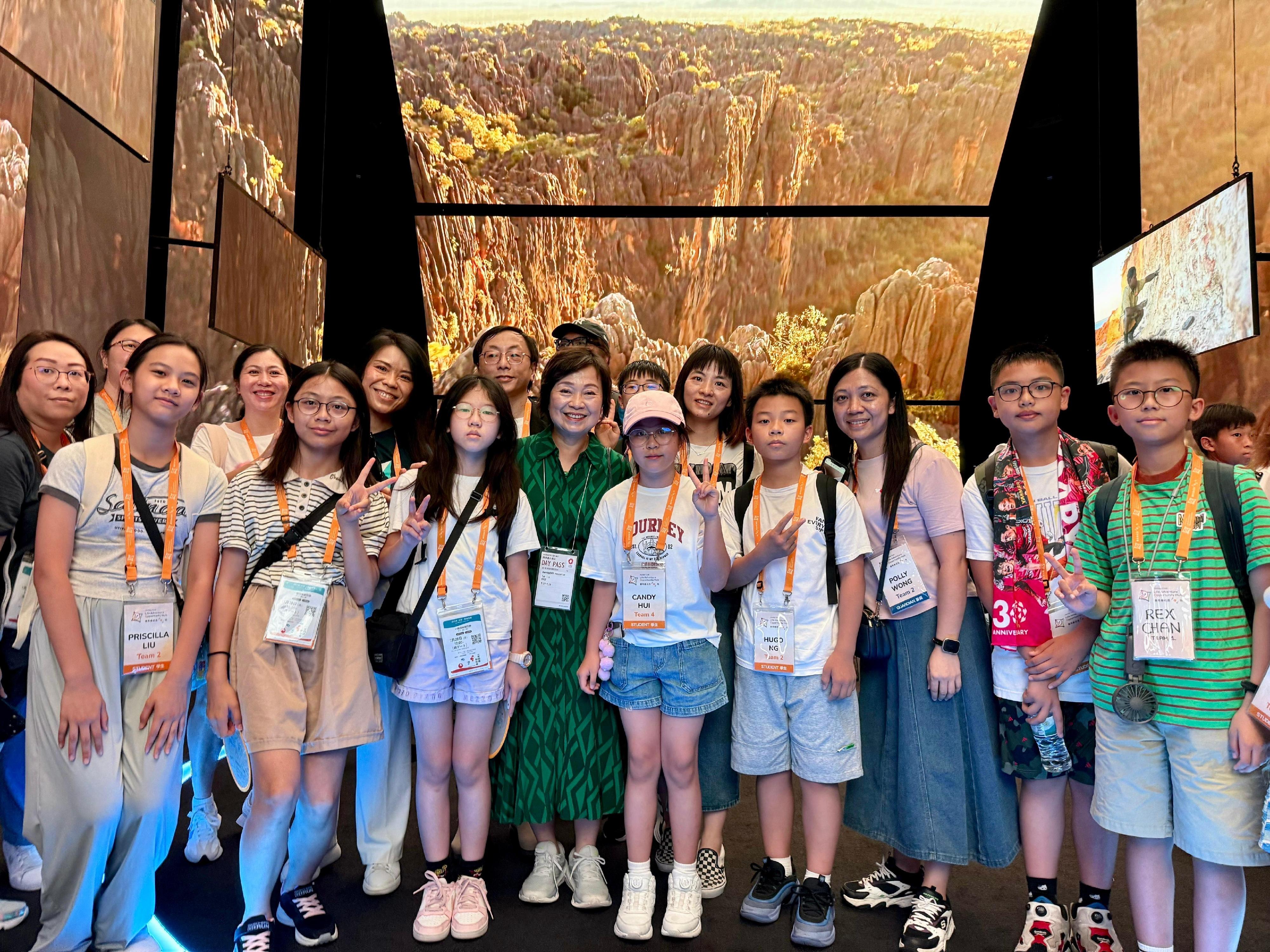 The Secretary for Education, Dr Choi Yuk-lin (front row, fourth left), tours the Australia Pavilion at the World Expo 2025 Osaka, Kansai, in Japan on July 28 with a group of Hong Kong students joining the summer overseas exchange trip organised by the Jockey Club Life Adventure Opportunity Hub.