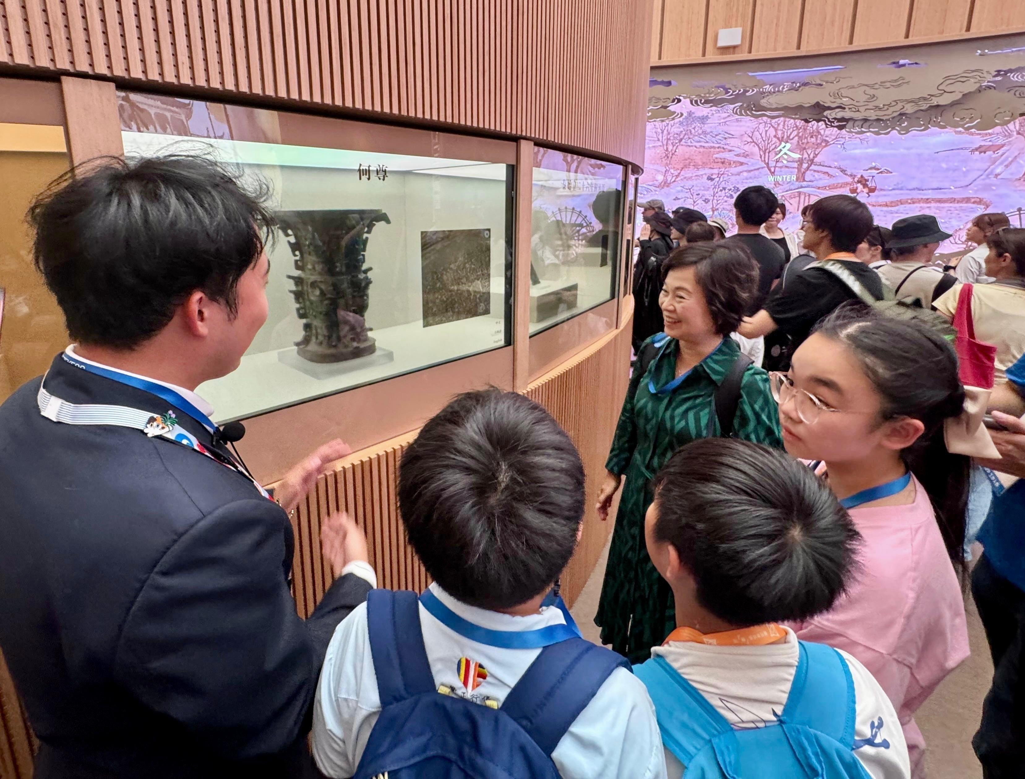 The Secretary for Education, Dr Choi Yuk-lin (second right), tours the China Pavilion at the World Expo 2025 Osaka, Kansai, in Japan on July 28 with a group of Hong Kong students joining the summer overseas exchange trip organised by the Jockey Club Life Adventure Opportunity Hub.