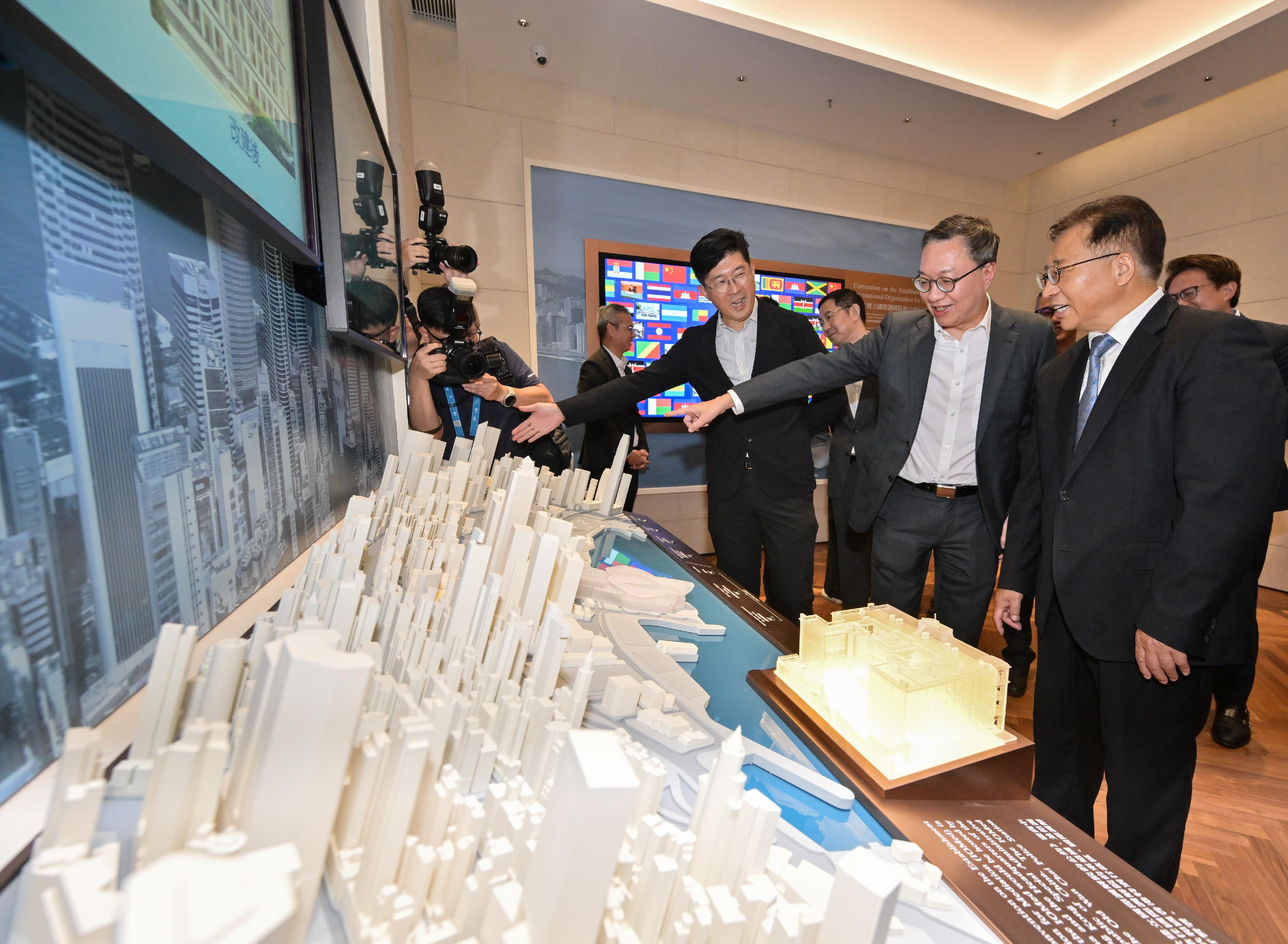 With the renovation project for the International Organization for Mediation headquarters building completed, the Secretary for Justice, Mr Paul Lam, SC, and the Commissioner of the Ministry of Foreign Affairs in the Hong Kong Special Administrative Region, Mr Cui Jianchun, visited the headquarters building today (July 30). Photo shows Mr Lam (centre) and Mr Cui (right) listening to the Director of Architectural Services, Mr Michael Li (left), on the design of the headquarters building.
