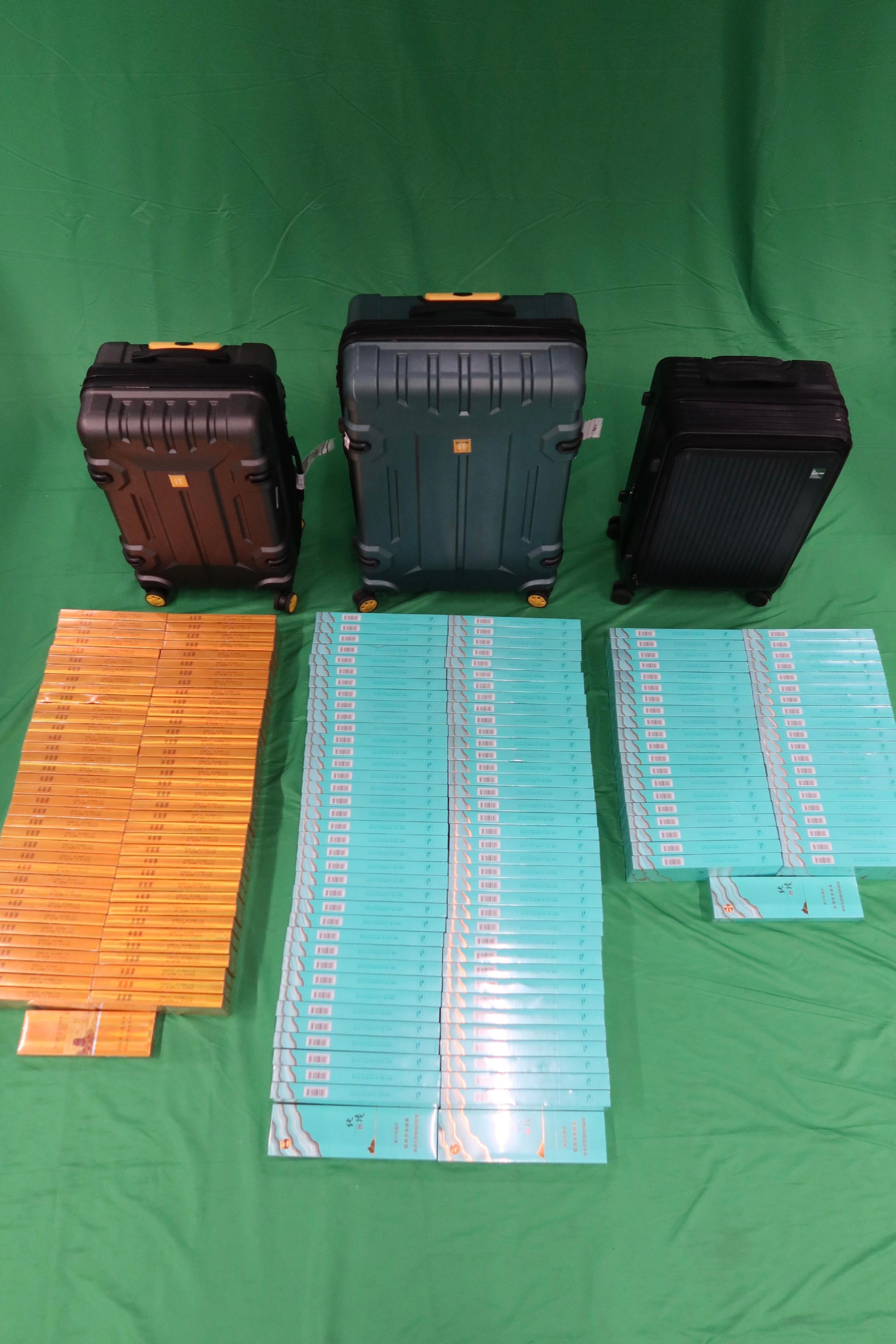 Three incoming male passengers were sentenced to three to seven months' imprisonment and fined between $1,000 and $2,000 at the West Kowloon Magistrates' Courts yesterday (July 30) and today (July 31) for importing or possessing duty-not-paid cigarettes and failing to declare them to Customs officers, as well as for importing alternative smoking products. Two incoming passengers, a 46 year old and a 32 year old, were sentenced to six and seven months imprisonment respectively and fined $2,000 each today for importing duty-not-paid cigarettes and failing to declare them to Customs officers, in contravention of the Dutiable Commodities Ordinance. Photo shows the duty-not-paid cigarettes seized.

