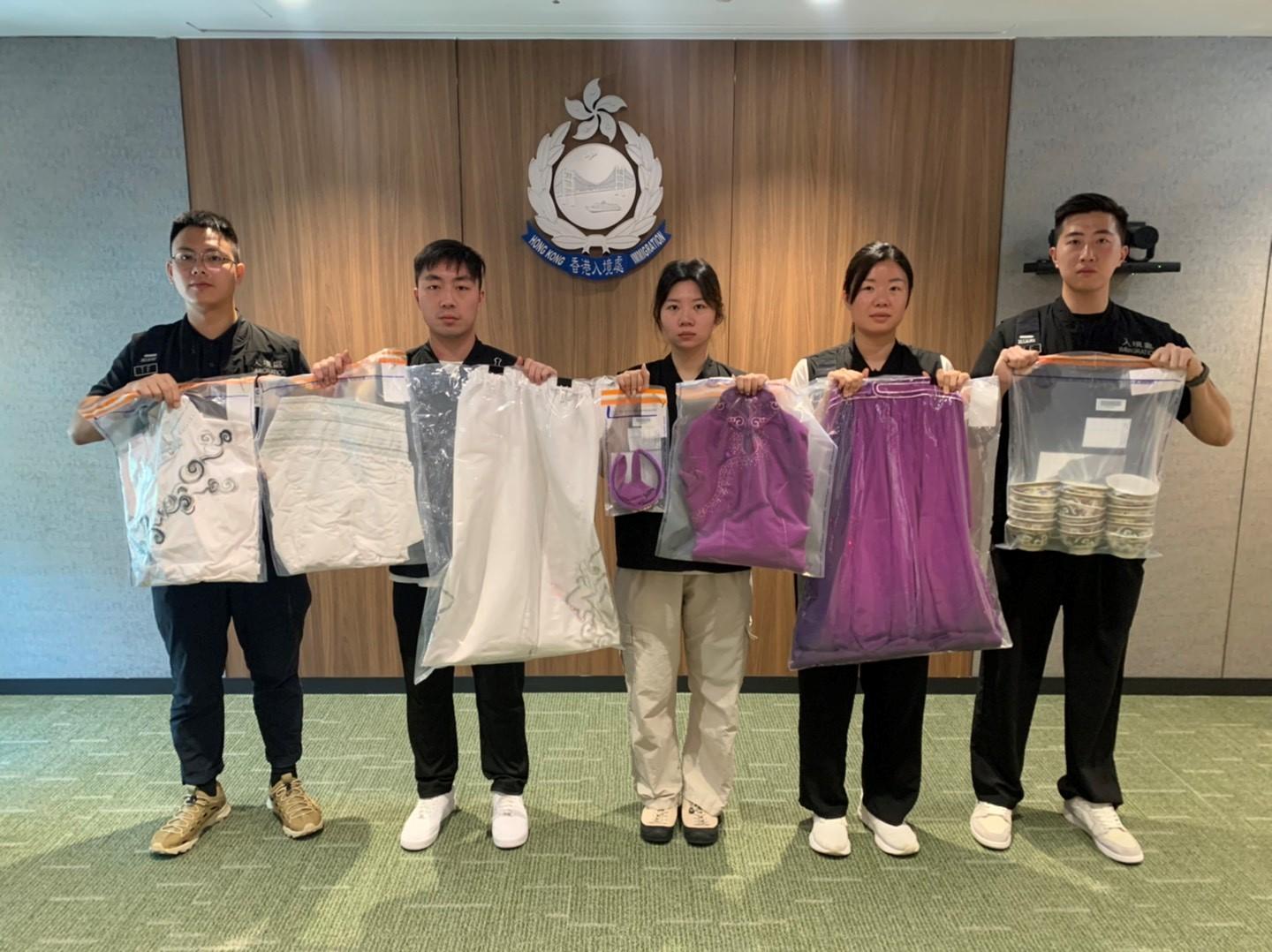 The Immigration Department mounted an anti-illegal worker operation in Kwun Tong on July 28. Photo shows the items seized during the operation.