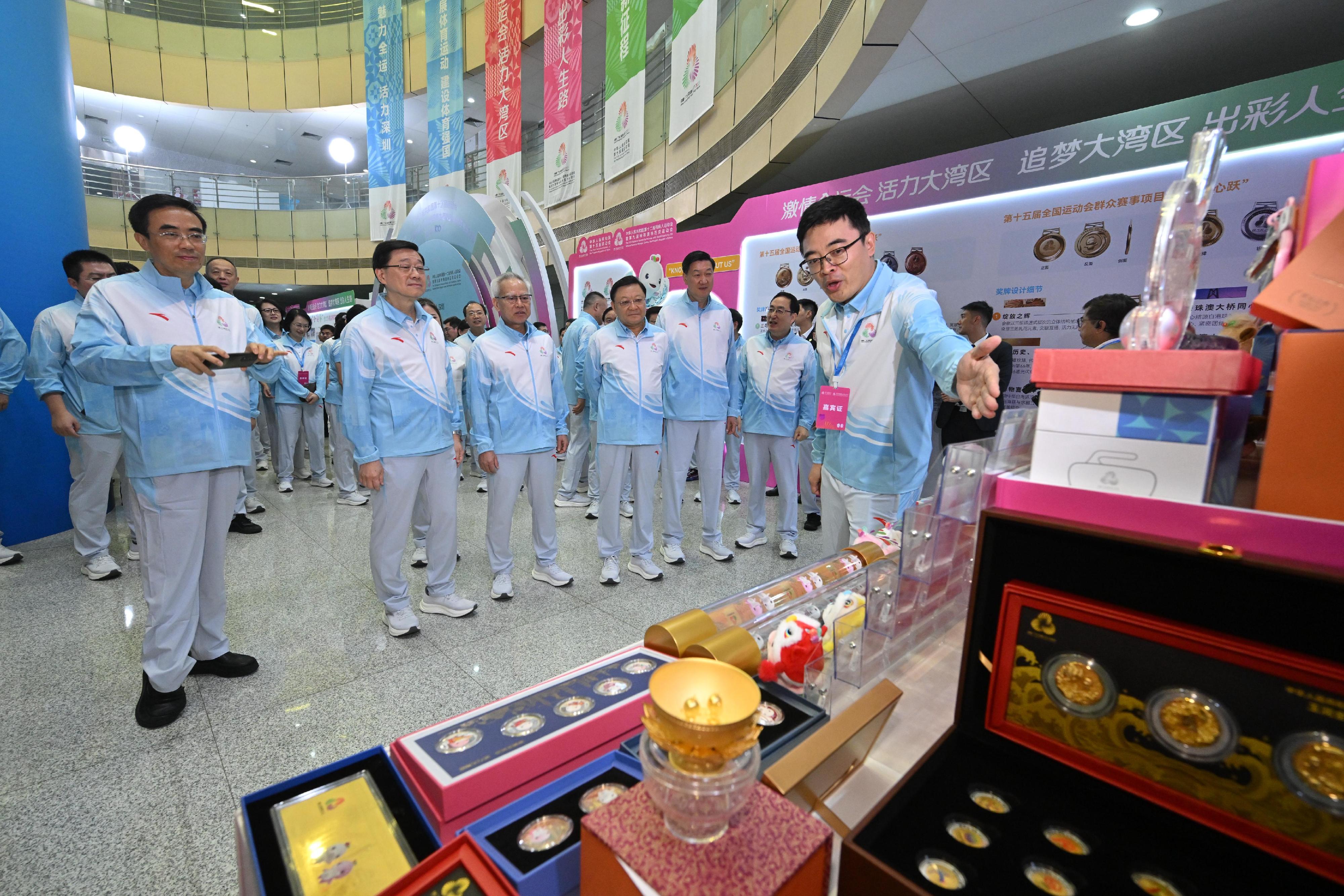 The Chief Executive, Mr John Lee, attended the launch ceremony of the 100-day countdown event of the 15th National Games, the 12th National Games for Persons with Disabilities and the 9th National Special Olympic Games in Shenzhen today (August 2). Photo shows (from second left) Mr Lee; the Chief Executive of the Macao Special Administrative Region, Mr Sam Hou-fai; the Governor of Guangdong Province, Mr Wang Weizhong and the Director of the General Administration of Sport of China, Mr Gao Zhidan visiting the exhibition.