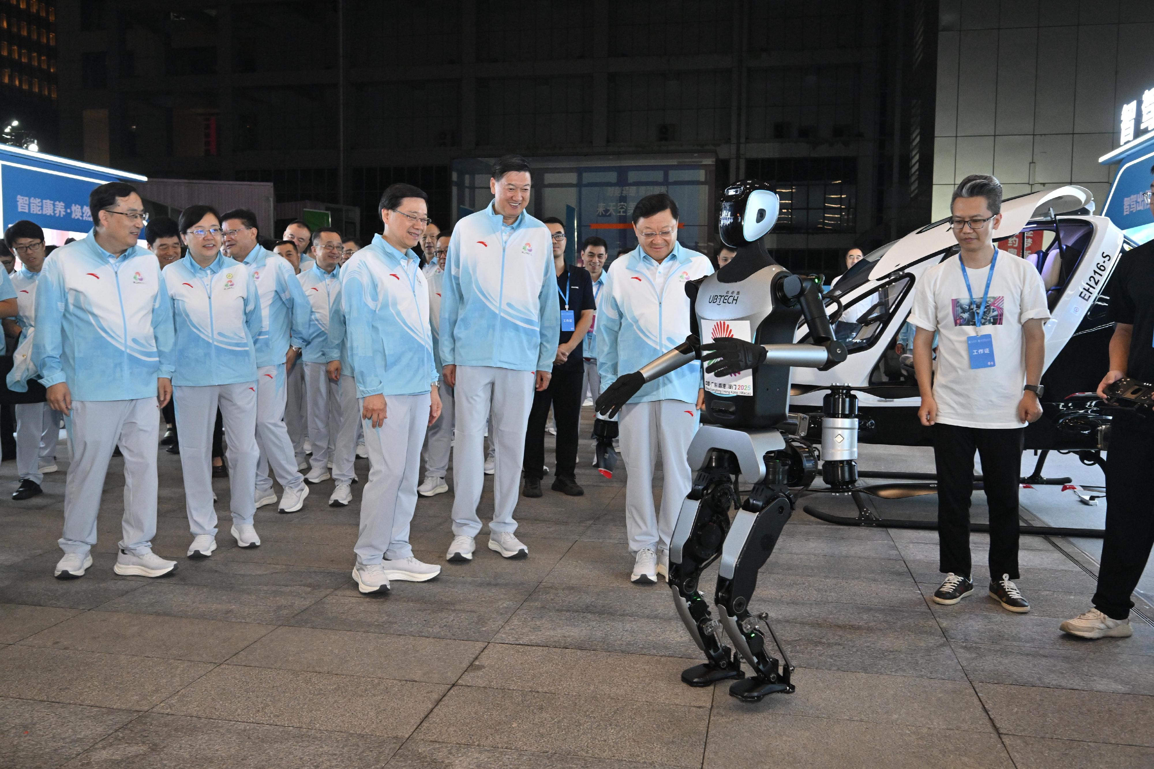 The Chief Executive, Mr John Lee, attended the launch ceremony of the 100-day countdown event of the 15th National Games, the 12th National Games for Persons with Disabilities and the 9th National Special Olympic Games in Shenzhen today (August 2). Photo shows (from third left) Mr Lee; the Director of the General Administration of Sport of China, Mr Gao Zhidan and the Governor of Guangdong Province, Mr Wang Weizhong visiting the exhibition.