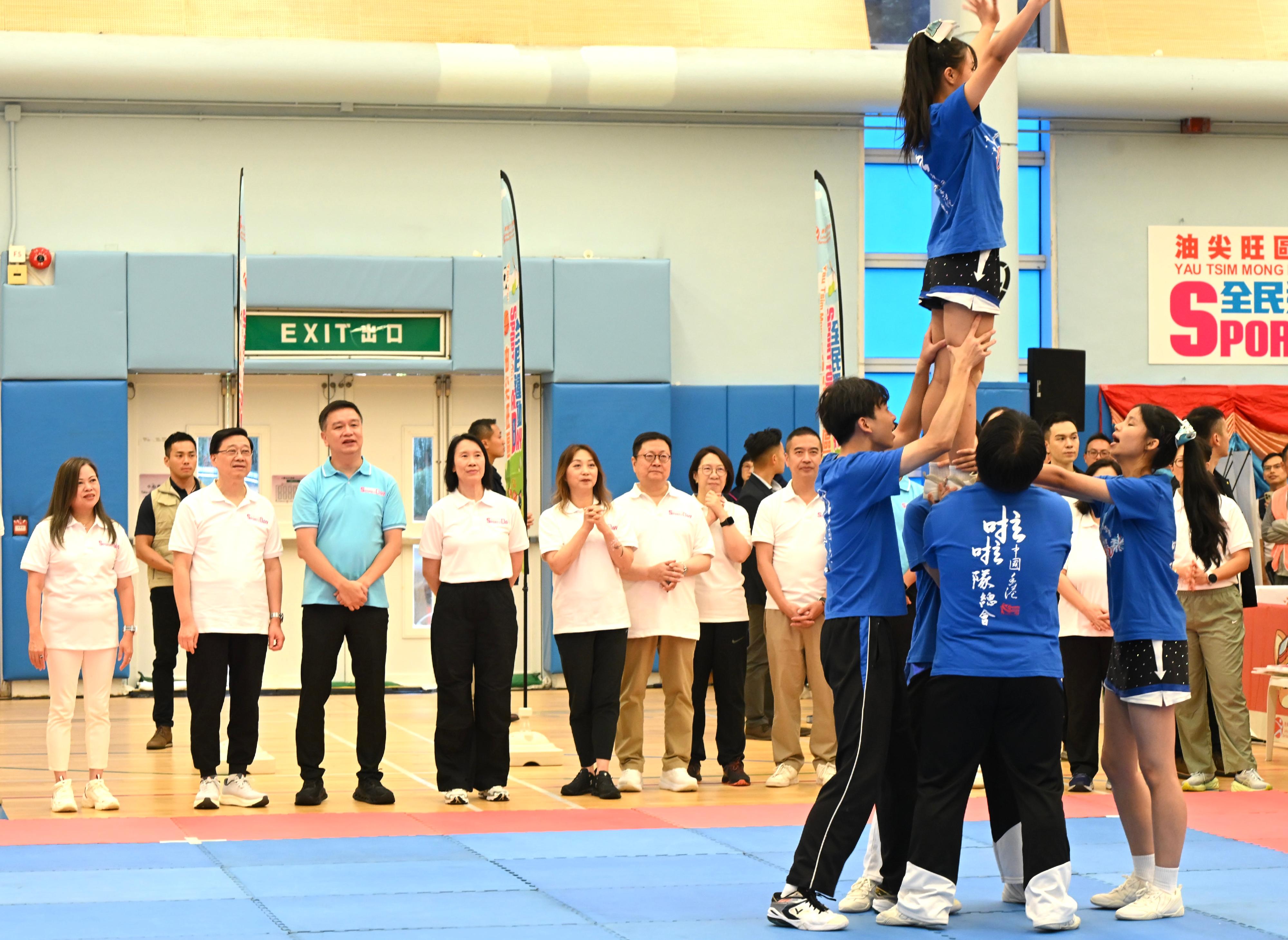 The Chief Executive, Mr John Lee, this afternoon (August 3) attended activities at the Kowloon Park Sports Centre main venue of the Sport For All Day 2025 held by the Leisure and Cultural Services Department, conveying to the public the benefits of regular exercise for physical and mental well-being. Photo shows Mr Lee (second left) and other guests watching a cheerleading performance.
