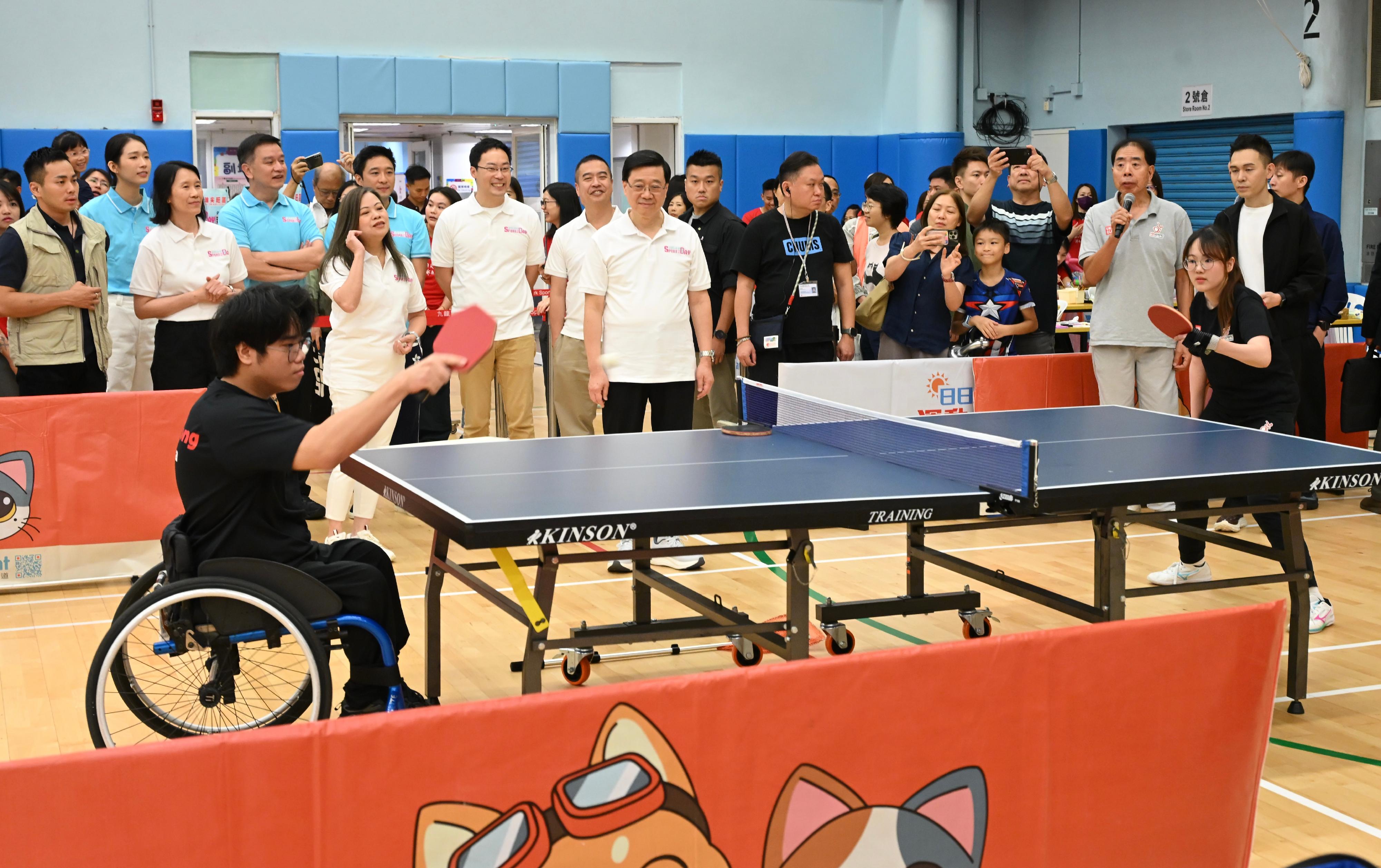 The Chief Executive, Mr John Lee, this afternoon (August 3) attended activities at the Kowloon Park Sports Centre main venue of the Sport For All Day 2025 held by the Leisure and Cultural Services Department, conveying to the public the benefits of regular exercise for physical and mental well-being. Photo shows Mr Lee (second row, fourth left) and other guests watching a demonstration of table tennis activities for persons with different abilities.
