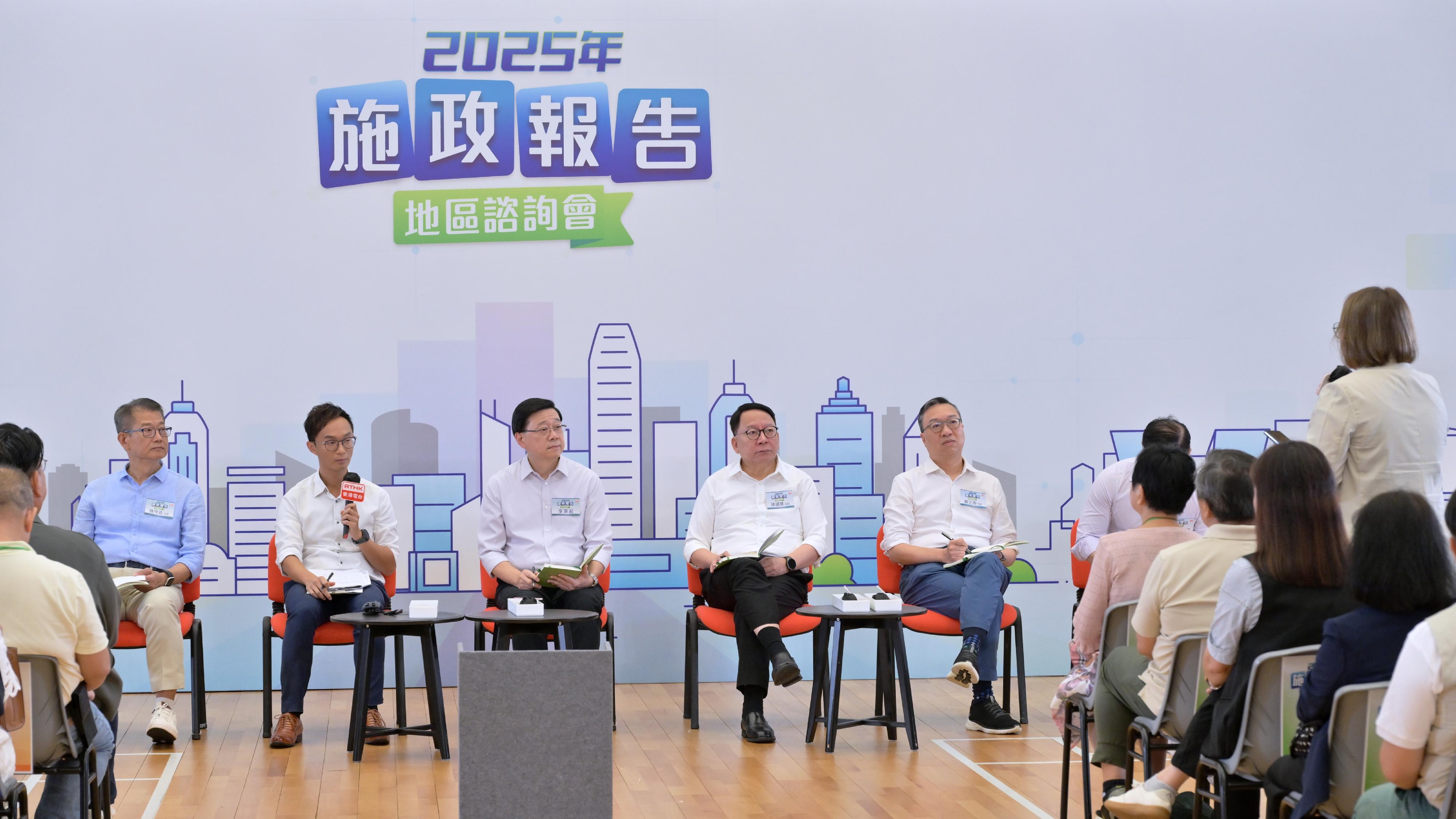 The Chief Executive, Mr John Lee, attended the second 2025 Policy Address District Forum with some Principal Officials this morning (August 3) to listen to views and suggestions from local community members on the upcoming Policy Address. Photo shows Mr Lee (centre); the Chief Secretary for Administration, Mr Chan Kwok-ki (second right); the Financial Secretary, Mr Paul Chan (first left), and the Secretary for Justice, Mr Paul Lam, SC (first right), listening to views from the public at the consultation session.