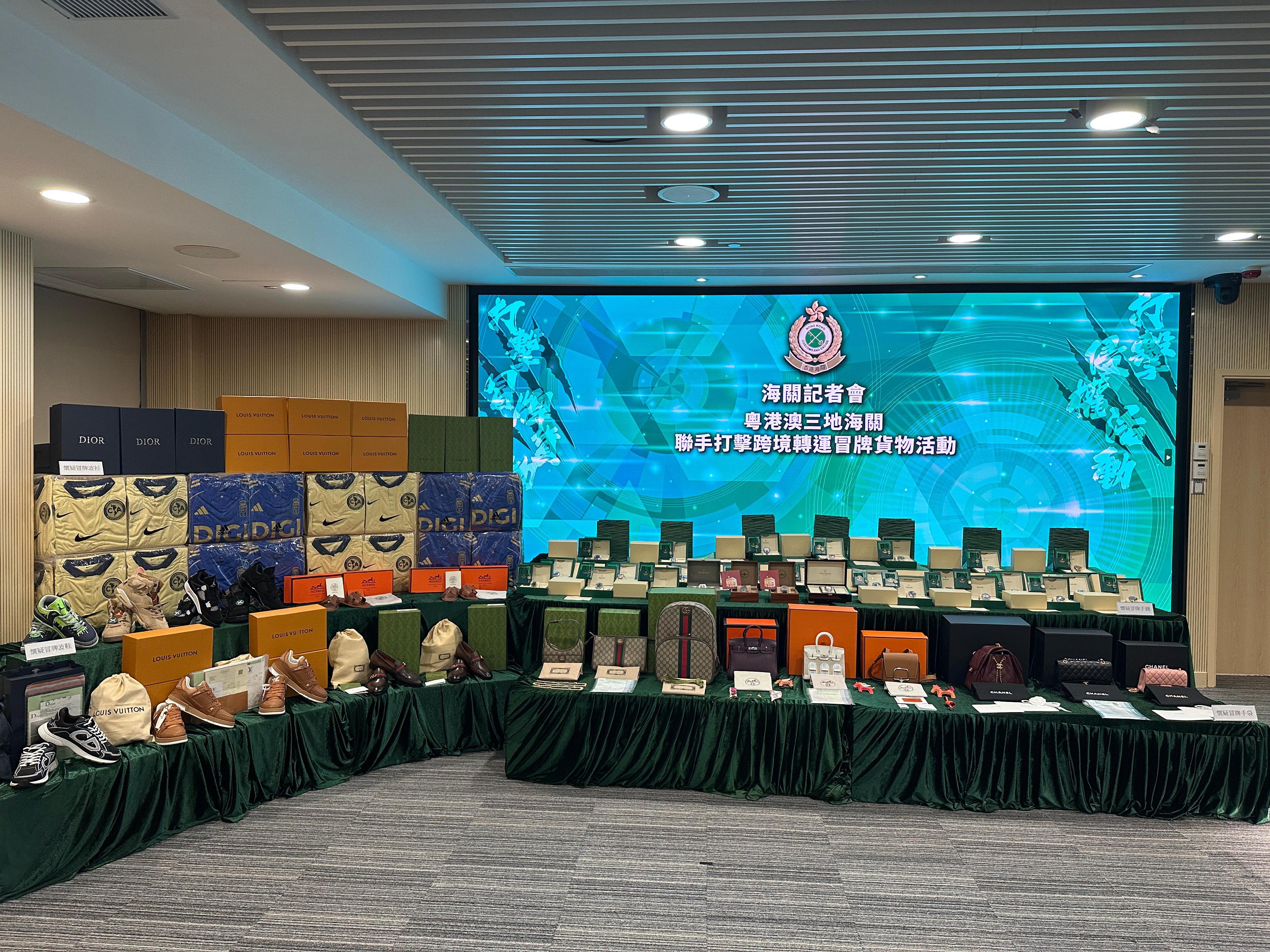 Hong Kong Customs conducted a two-week enforcement operation with the Mainland and Macao Customs from July 18 to 31, during which inspections of goods across the three places and destined for America, Europe, and countries and regions along the Belt and Road Initiative were stepped up, with a view to combating cross-boundary and transshipment counterfeiting activities. During the operation, Hong Kong Customs detected 25 cases and seized about 67 000 suspected counterfeit goods, including watches, handbags, jerseys and footwear, with a total estimated market value of about $44 million. Photo shows some of the suspected counterfeit goods seized.