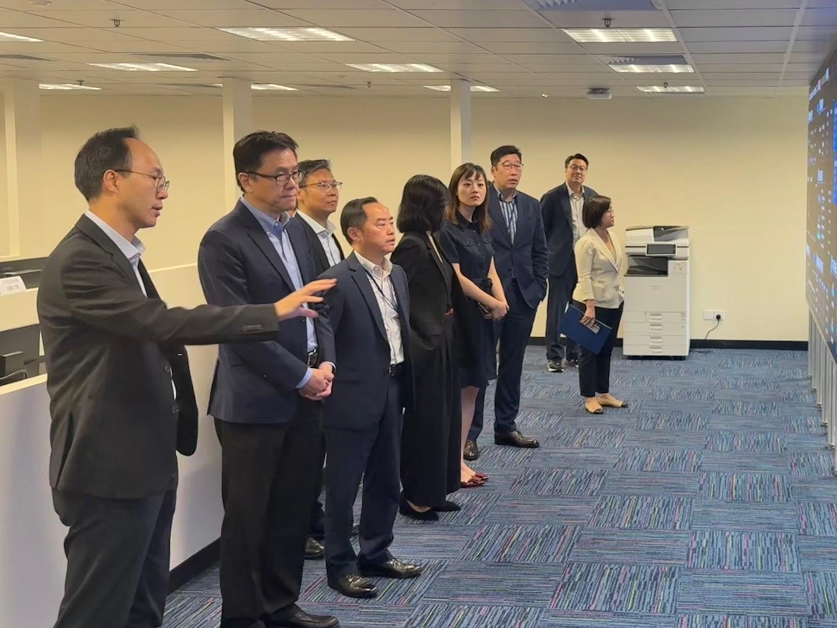 The Secretary for Innovation, Technology and Industry, Professor Sun Dong (second left); the Under Secretary for Innovation, Technology and Industry, Ms Lillian Cheong (fourth right); the Commissioner for Digital Policy, Mr Tony Wong (third left); and the Deputy Commissioner for Digital Policy (Digital Infrastructure), Mr Daniel Cheung (third right), yesterday (August 11) received a briefing from the Digital Policy Office's working team on the IT systems for the Hong Kong competition region for the 15th National Games, the 12th National Games for Persons with Disabilities and the 9th National Special Olympic Games.