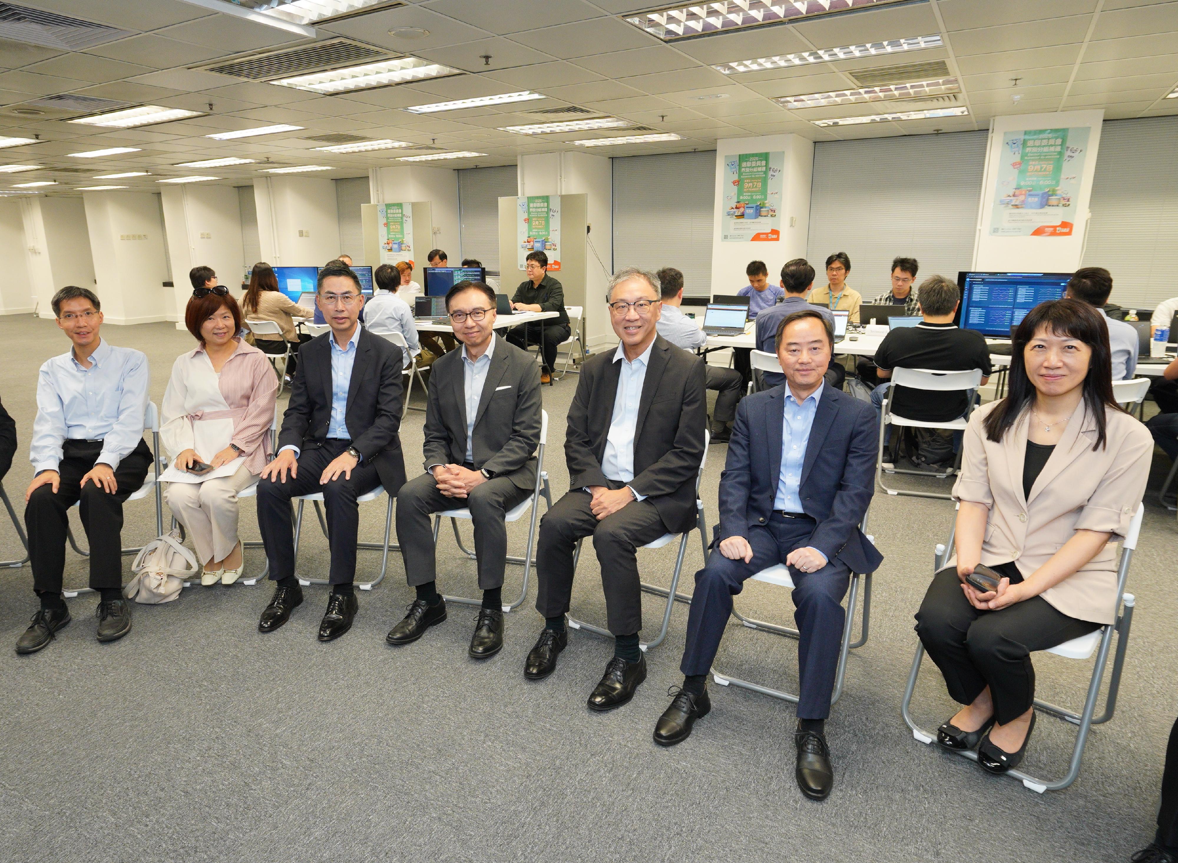 The Registration and Electoral Office (REO) and the Digital Policy Office (DPO) hosted a drill on technical support for regular and contingency arrangements of the Electronic Poll Register (EPR) System today (August 13) for comprehensive preparation and detailed planning for the Election Committee Subsector By-elections to be held on September 7 and the Legislative Council General Election to be held on December 7. The Commissioner for Digital Policy, Mr Tony Wong (second right), acted as the Information Technology Commander for the drill with the participation of technical support teams from the DPO and the REO as well as the EPR System contractor. The Chairman of the Electoral Affairs Commission, Mr Justice David Lok (third right); the Chief Electoral Officer of the REO, Ms Natalie Chan (first right); the Convenor of the Technical Advisory Committee (TAC), Mr Sunny Lee (centre), and Members of the TAC, Mr Wilson Wong (third left), Ms Susanna Shen (second left) and Mr Raymond Wong (first left) were also present.