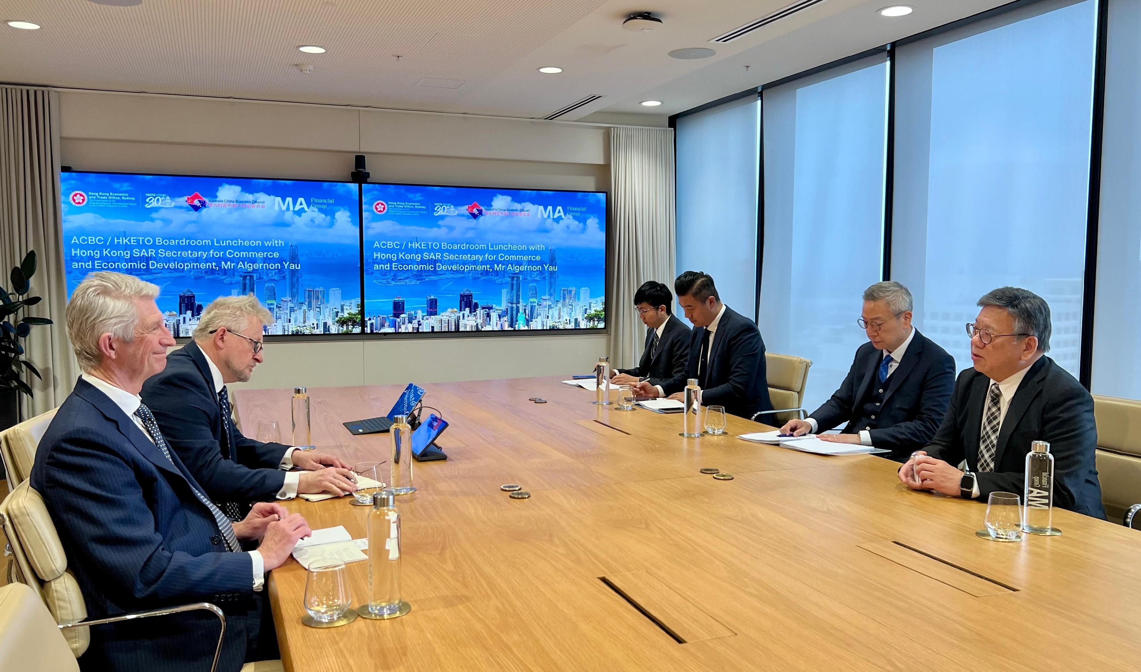The Secretary for Commerce and Economic Development, Mr Algernon Yau, continued his visit to Sydney, Australia, today (August 14) to promote Hong Kong's advantages as an international trade centre and a premier destination for business and investment. Photo shows Mr Yau (first right) meeting with the National President of the Australia China Business Council, Mr David Olsson (first left), to brief him on the direction of Hong Kong's economic development and new initiatives to promote trade. Looking on is the Director of the Hong Kong Economic and Trade Office, Sydney, Mr Ricky Chong (second right).