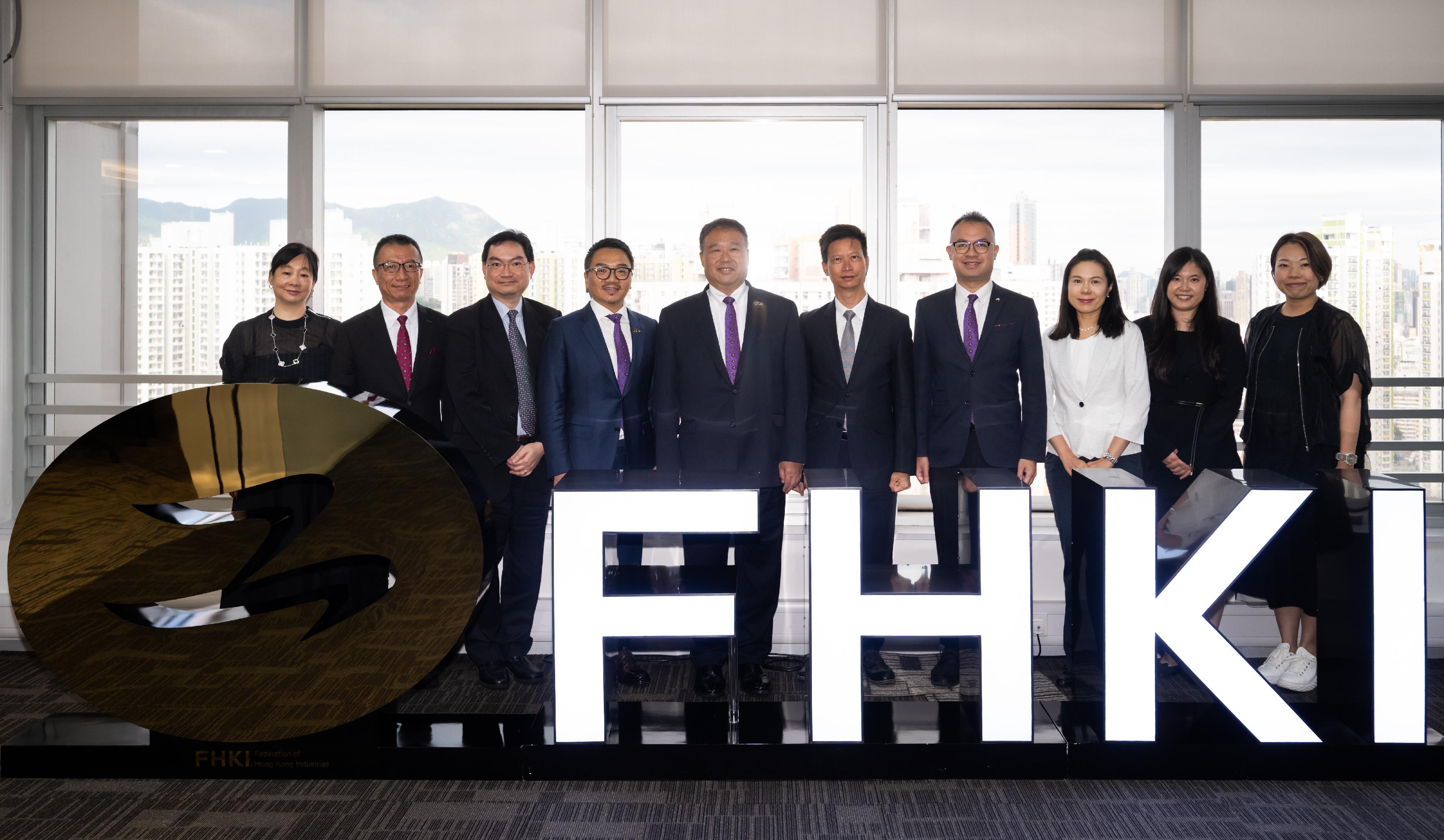 The Commissioner for Labour, Mr Sam Hui, has visited labour organisations and employer associations in the past month to strengthen communication and engagement with employees and employers. Photo shows Mr Hui (fifth right) visiting the Federation of Hong Kong Industries.