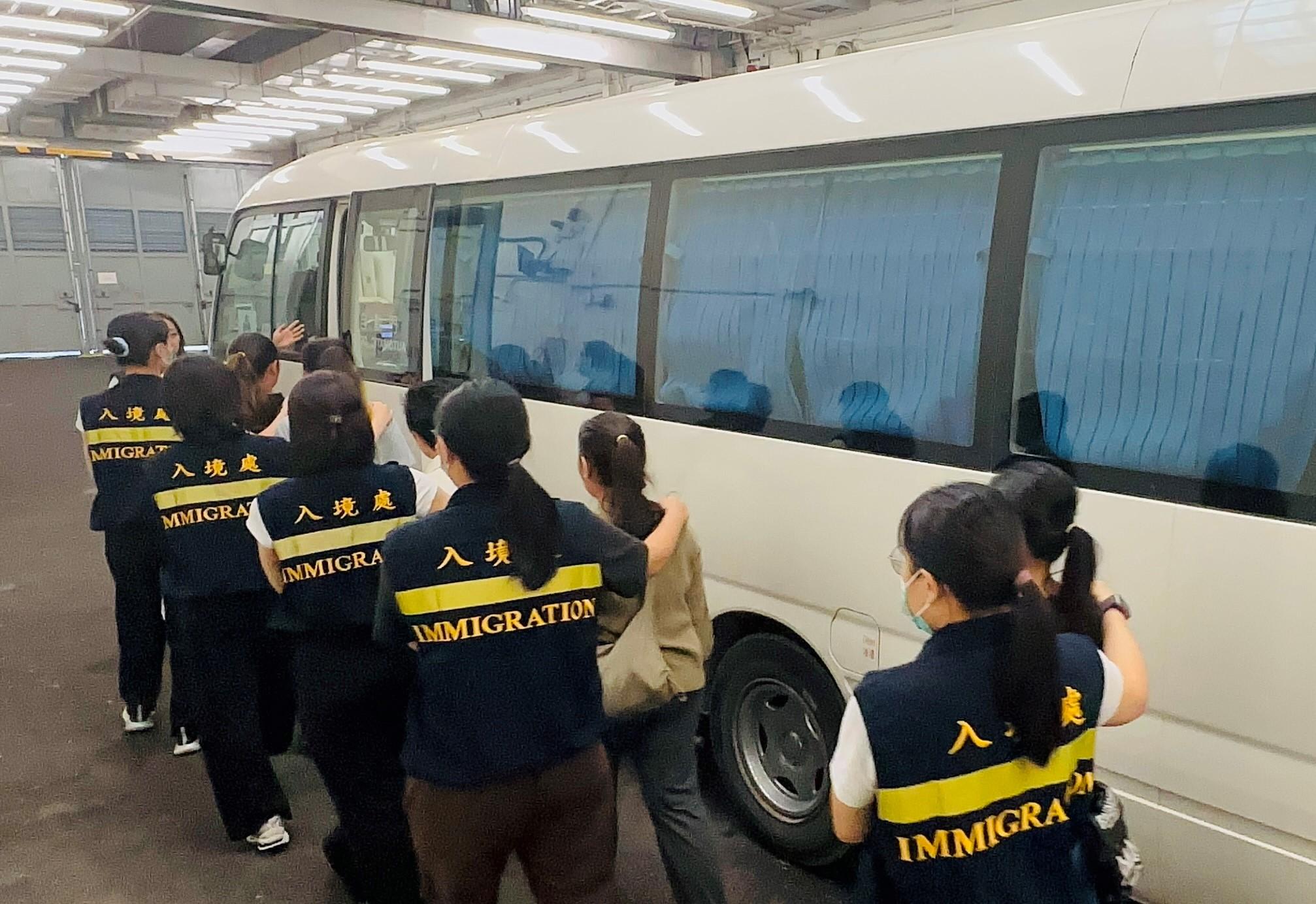 The Immigration Department (ImmD) carried out repatriation operations on August 13 and 14. A total of 25 unsubstantiated non-refoulement claimants were repatriated to their places of origin. Photo shows removees being escorted by ImmD officers to proceed from the detention place to the airport.