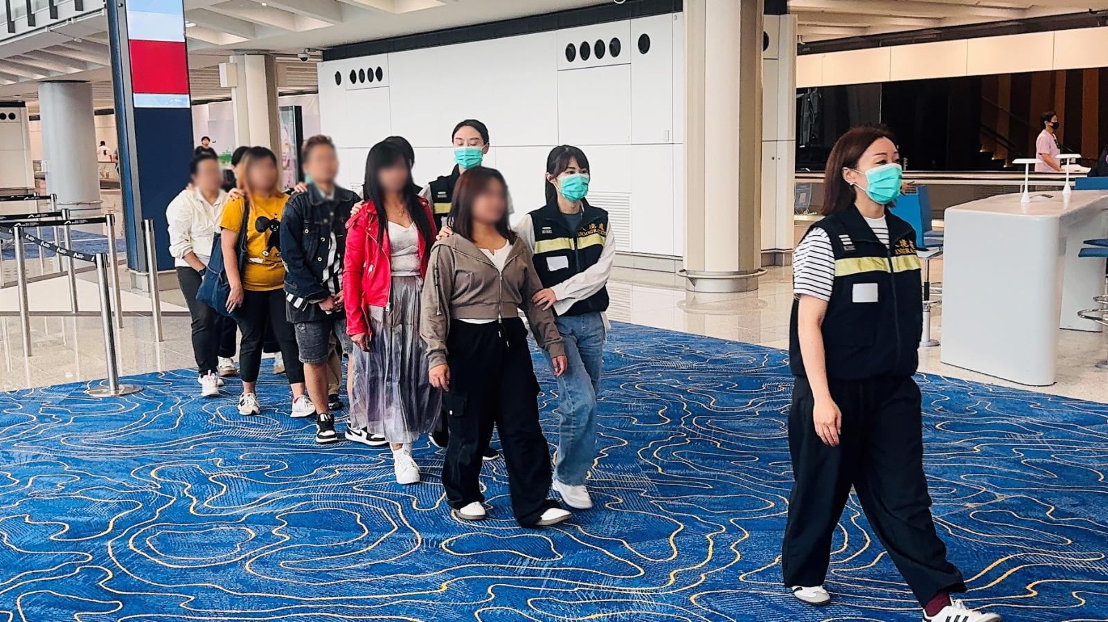 The Immigration Department (ImmD) carried out repatriation operations on August 13 and 14. A total of 25 unsubstantiated non-refoulement claimants were repatriated to their places of origin. Photo shows removees being escorted by ImmD officers to depart from Hong Kong.