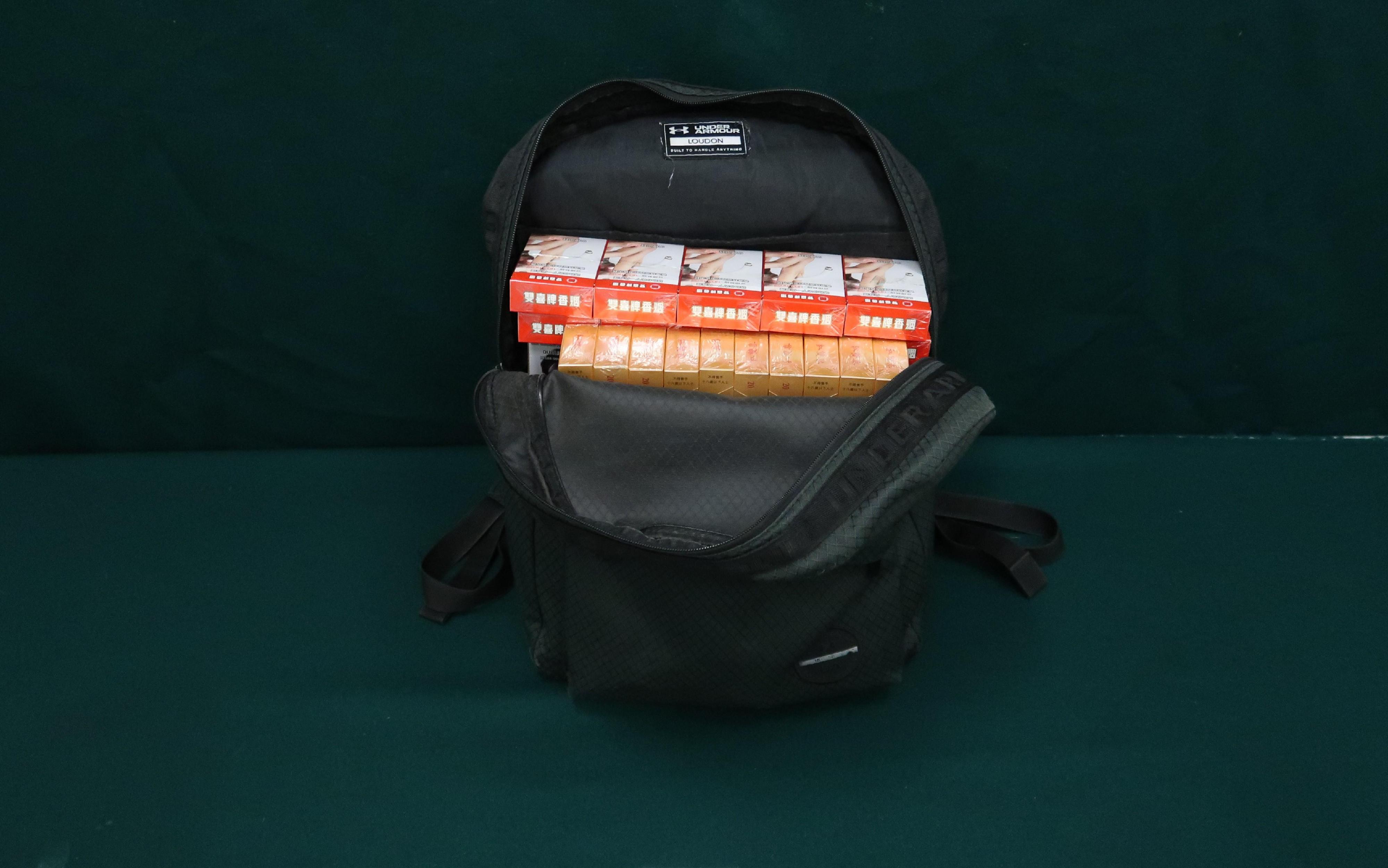 An incoming 59-year-old female passenger was sentenced to one month's imprisonment at the Fanling Magistrates' Courts on August 16 for possessing duty-not-paid cigarettes and failing to declare them to Customs officers, in contravention of the Dutiable Commodities Ordinance. Photo shows the duty-not-paid cigarettes seized inside her rucksack.