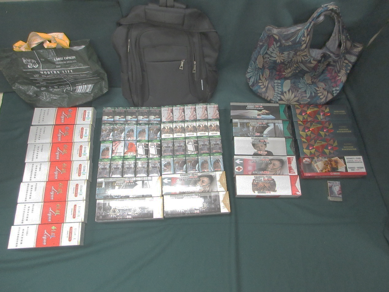 An incoming female passenger was sentenced to seven weeks' imprisonment and fined $4,000 at the Fanling Magistrates' Courts today (August 19) for being involved in two cases of possessing duty-not-paid cigarettes and cigars and failing to declare them to Customs officers, in contravention of the Dutiable Commodities Ordinance. Photo shows the duty-not-paid cigarettes seized at the Lo Wu Control Point.