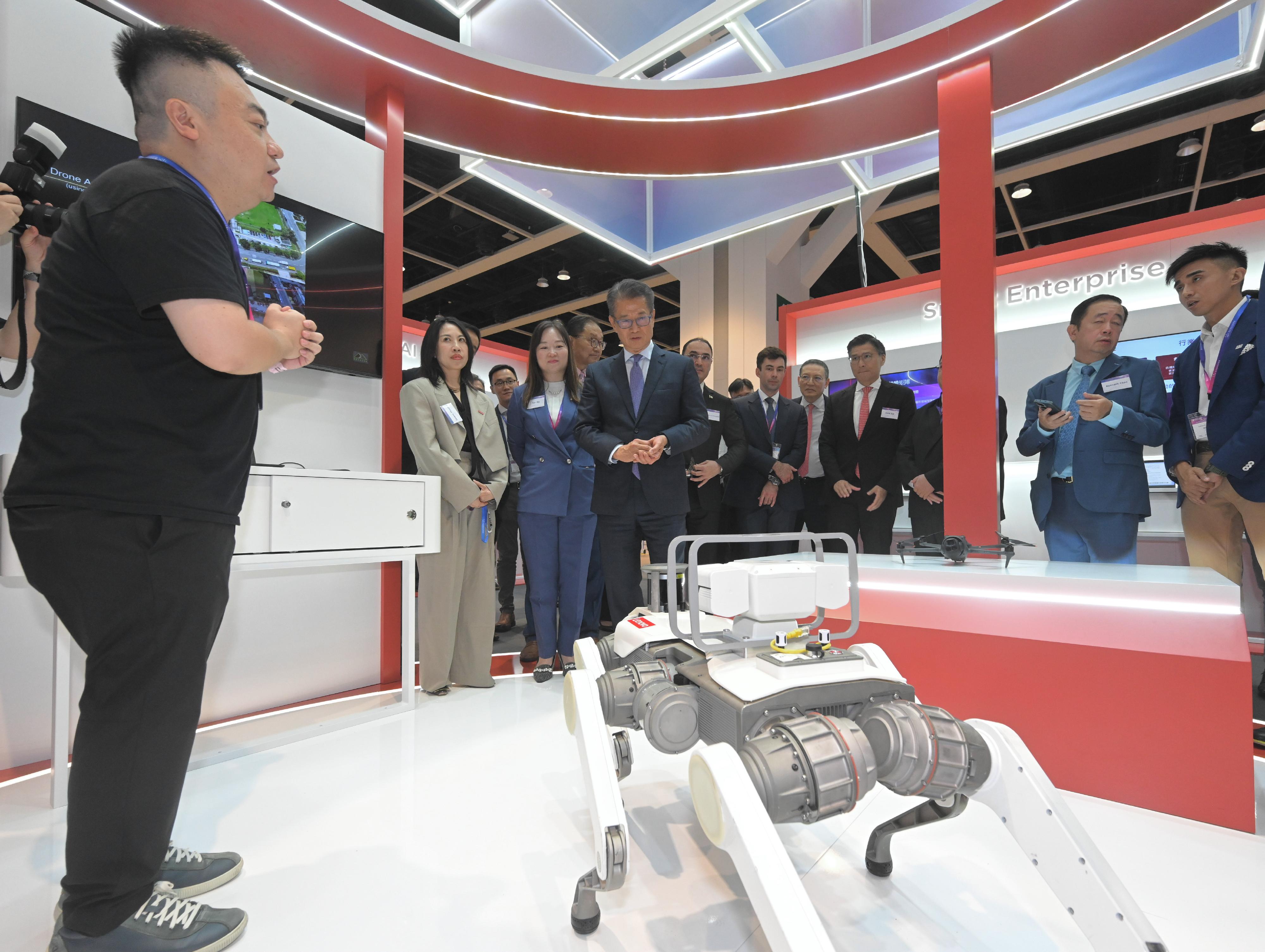 The Financial Secretary, Mr Paul Chan, attended the Opening Ceremony of the Belt and Road Software Pavilion (Hong Kong) 2025 today (August 21). Photo shows Mr Chan (third left) touring the Pavillion.