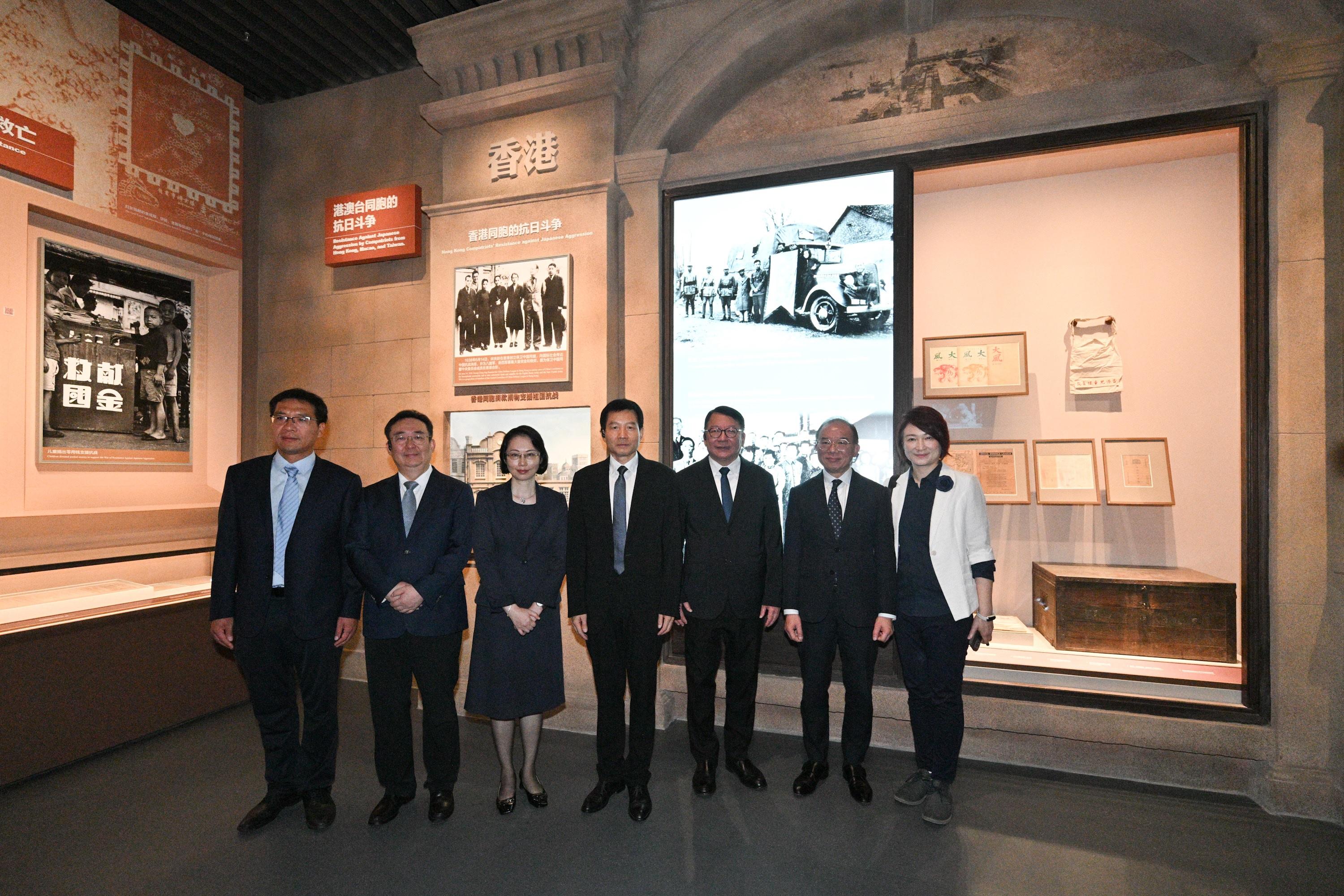 The Chief Secretary for Administration, Mr Chan Kwok-ki, attended the establishment ceremony of the Patriotic Education Base for Hong Kong and Macao Youth in Beijing today (August 21). Photo shows Mr Chan (third right) touring the Museum of the War of Chinese People's Resistance Against Japanese Aggression where the establishment ceremony was held. Looking on are the Executive Deputy Director of the Hong Kong and Macao Work Office of the CPC Central Committee and the Hong Kong and Macao Affairs Office of the State Council, Mr Xu Qifang (centre); Vice Mayor of Beijing Mr Xia Linmao (second left); the Secretary for Social Affairs and Culture of the Macao Special Administrative Region Government, Ms O Lam (third left); the Secretary for Constitutional and Mainland Affairs, Mr Erick Tsang Kwok-wai (second right), and the Convenor of the Working Group on Patriotic Education under the Constitution and Basic Law Promotion Steering Committee, Dr Starry Lee (first right).