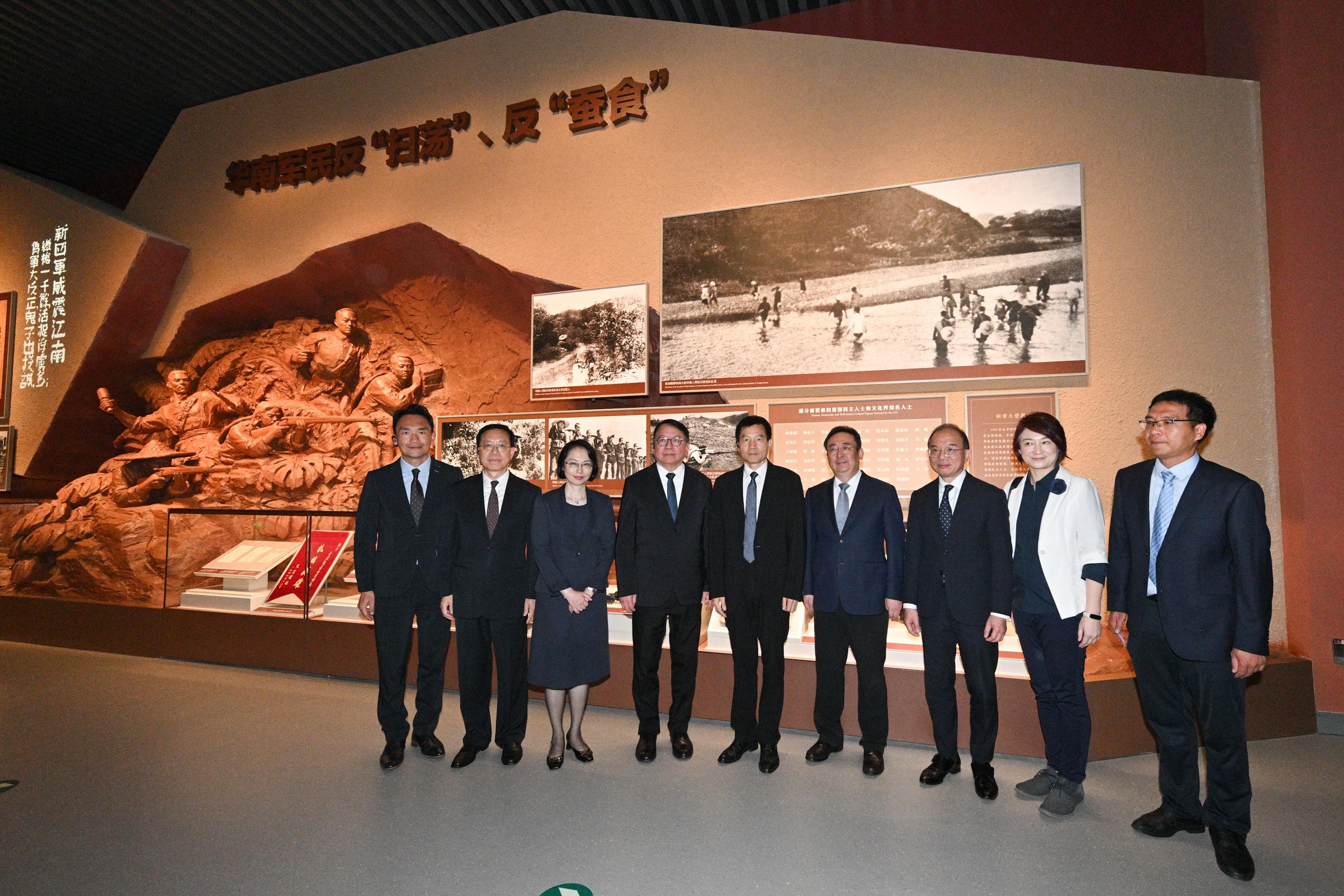The Chief Secretary for Administration, Mr Chan Kwok-ki, attended the establishment ceremony of the Patriotic Education Base for Hong Kong and Macao Youth in Beijing today (August 21). Photo shows Mr Chan (fourth left) touring the Museum of the War of Chinese People's Resistance Against Japanese Aggression where the establishment ceremony was held. Looking on are the Executive Deputy Director of the Hong Kong and Macao Work Office of the CPC Central Committee and the Hong Kong and Macao Affairs Office of the State Council, Mr Xu Qifang (centre); Vice Mayor of Beijing Mr Xia Linmao (fourth right); the Secretary for Social Affairs and Culture of the Macao Special Administrative Region Government, Ms O Lam (third left); the Secretary for Constitutional and Mainland Affairs, Mr Erick Tsang Kwok-wai (third right), and the Convenor of the Working Group on Patriotic Education under the Constitution and Basic Law Promotion Steering Committee, Dr Starry Lee (second right).