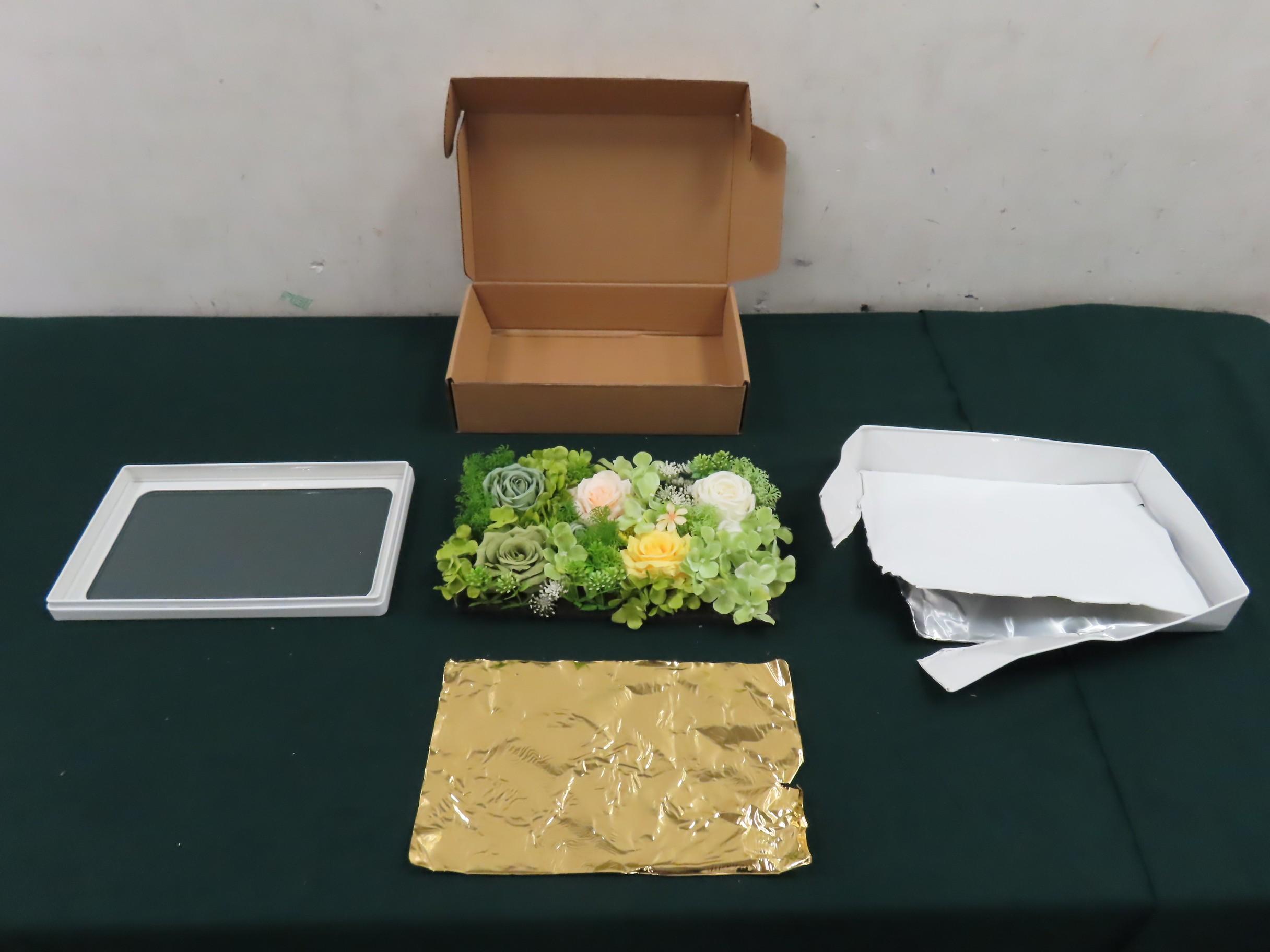 Hong Kong Customs on August 13 detected a suspected gold-smuggling case by air freight, and seized about 26.2 kilograms of suspected gold with an estimated market value of about $22 million at Hong Kong International Airport. Photo shows some of the suspected gold seized and a plastic flower box used as camouflage.  