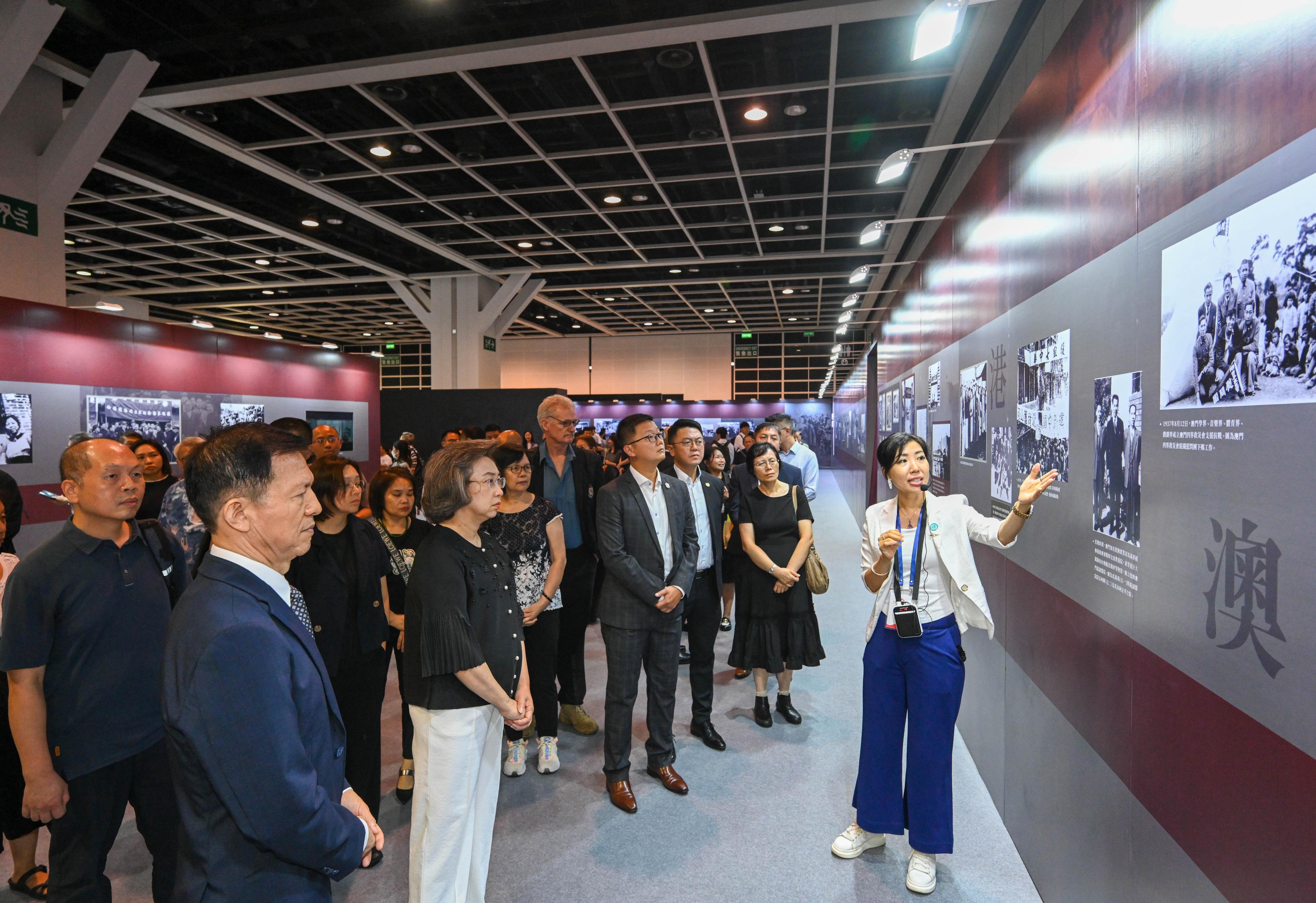 The Secretary for the Civil Service, Mrs Ingrid Yeung (front row, second left), together with representatives from civil service staff unions, visited "Remembering History Cherishing Peace" roving exhibition in commemoration of 80th Anniversary of Victory in Chinese People's War of Resistance against Japanese Aggression and World Anti-Fascist War at the Hong Kong Convention and Exhibition Centre this evening (August 25) to gain a deeper understanding of the war of resistance against Japan to protect the country, remember history and honour martyrs. Looking on is the Chief Editor of Ta Kung Pao, Mr Yu Shijun (front row, first left). 