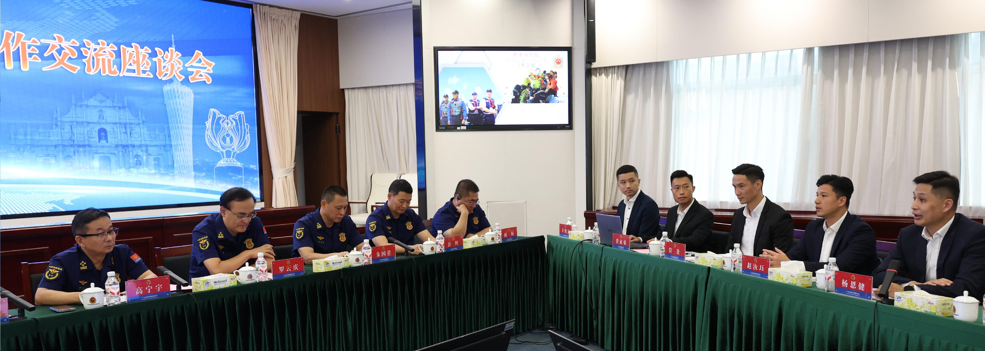 The Director of Fire Services, Mr Andy Yeung, led a delegation to Guangzhou today (August 26) to convene a Guangdong, Hong Kong and Macao fire services security meeting for the 15th National Games with representatives from the Fire and Rescue Corps of Guangdong Province and the Macao Fire Services Bureau. Photo shows Mr Yeung (first right) exchanging views with representatives of the Fire and Rescue Corps of Guangdong Province at the meeting.