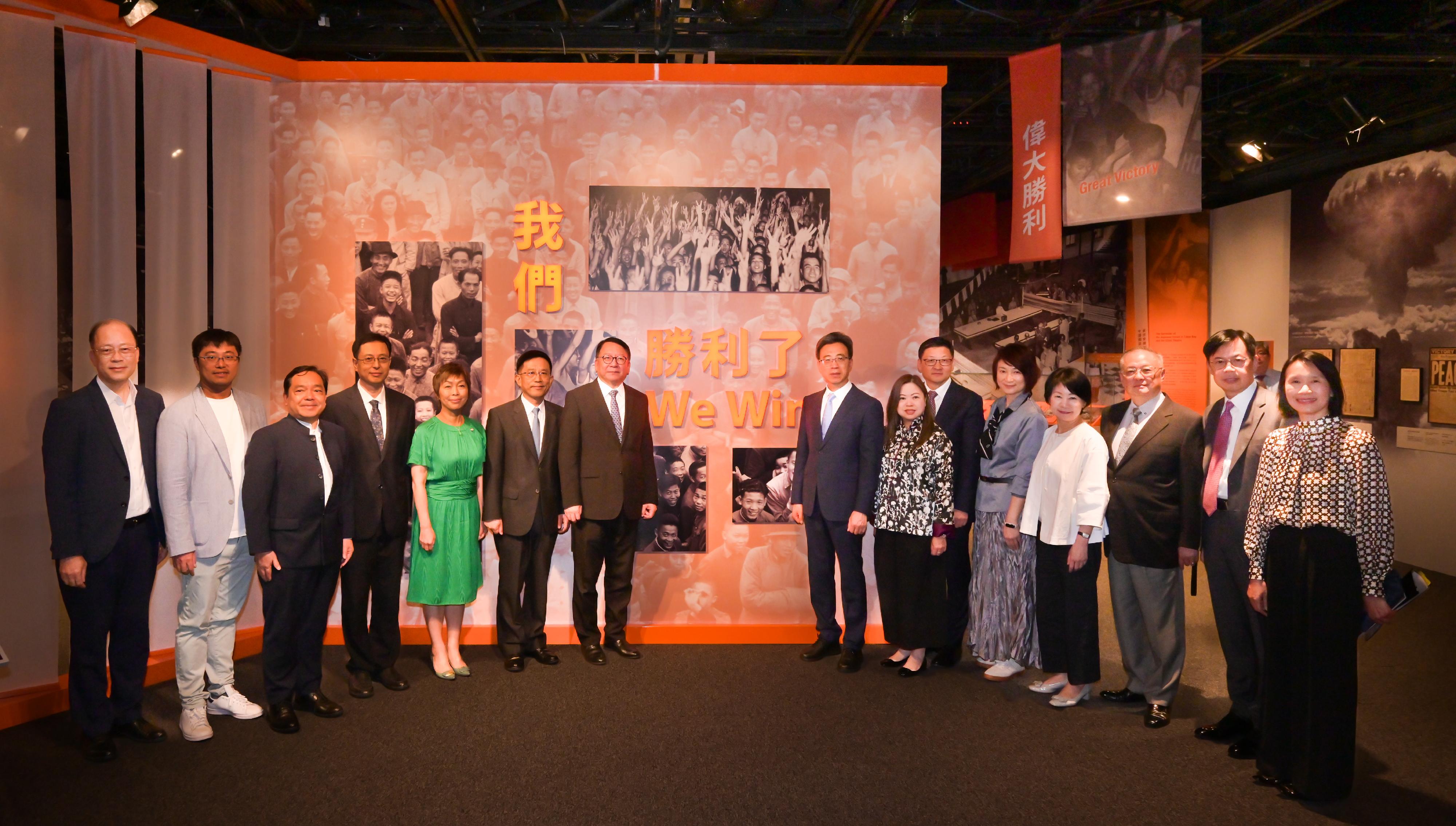 The Chief Secretary for Administration, Mr Chan Kwok-ki, attended the opening ceremony of "The Hong Kong Jockey Club Series: United in Arms, Standing for Peace - 80th Anniversary of Chinese Victory in the War of Resistance Exhibition" today (August 26). Photo shows Mr Chan Kwok-ki (seventh left) with other guests in an exhibition tour.
